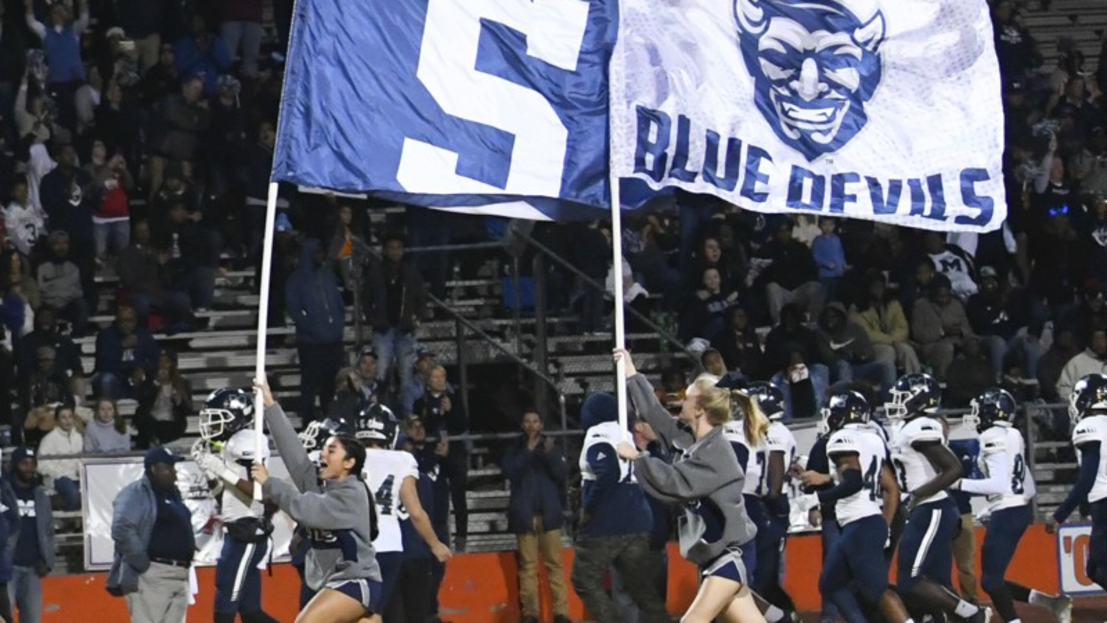 Marietta cheerleaders lead their team on to the field to take on Parkview during the semifinals last week Marietta won 42-31 to advance to the state finals for the first time since 1967. Photo by John Amis / Special