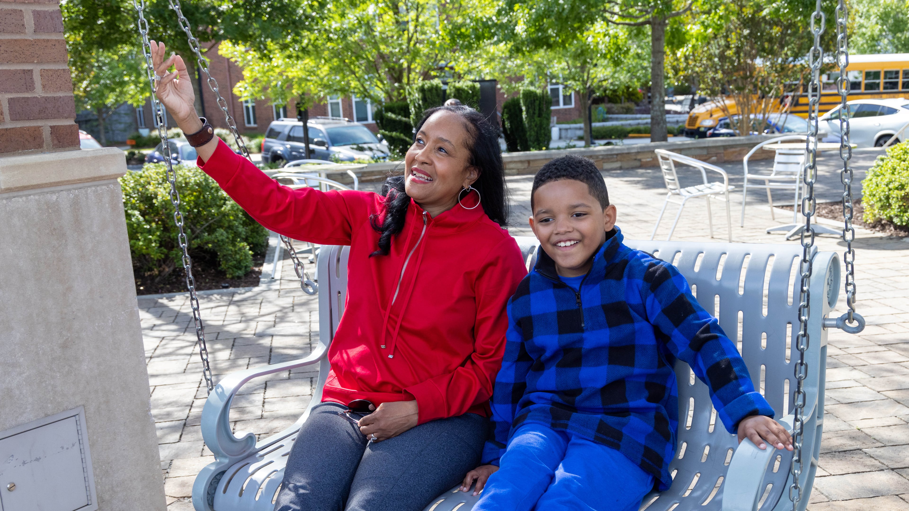 Immanuel Stephens swings with his mother Lisa at the Sandy Springs City Green Park. Immanuel , 7, participated in the Autism Transit Project for MARTA. PHIL SKINNER FOR THE ATLANTA JOURNAL-CONSTITUTION