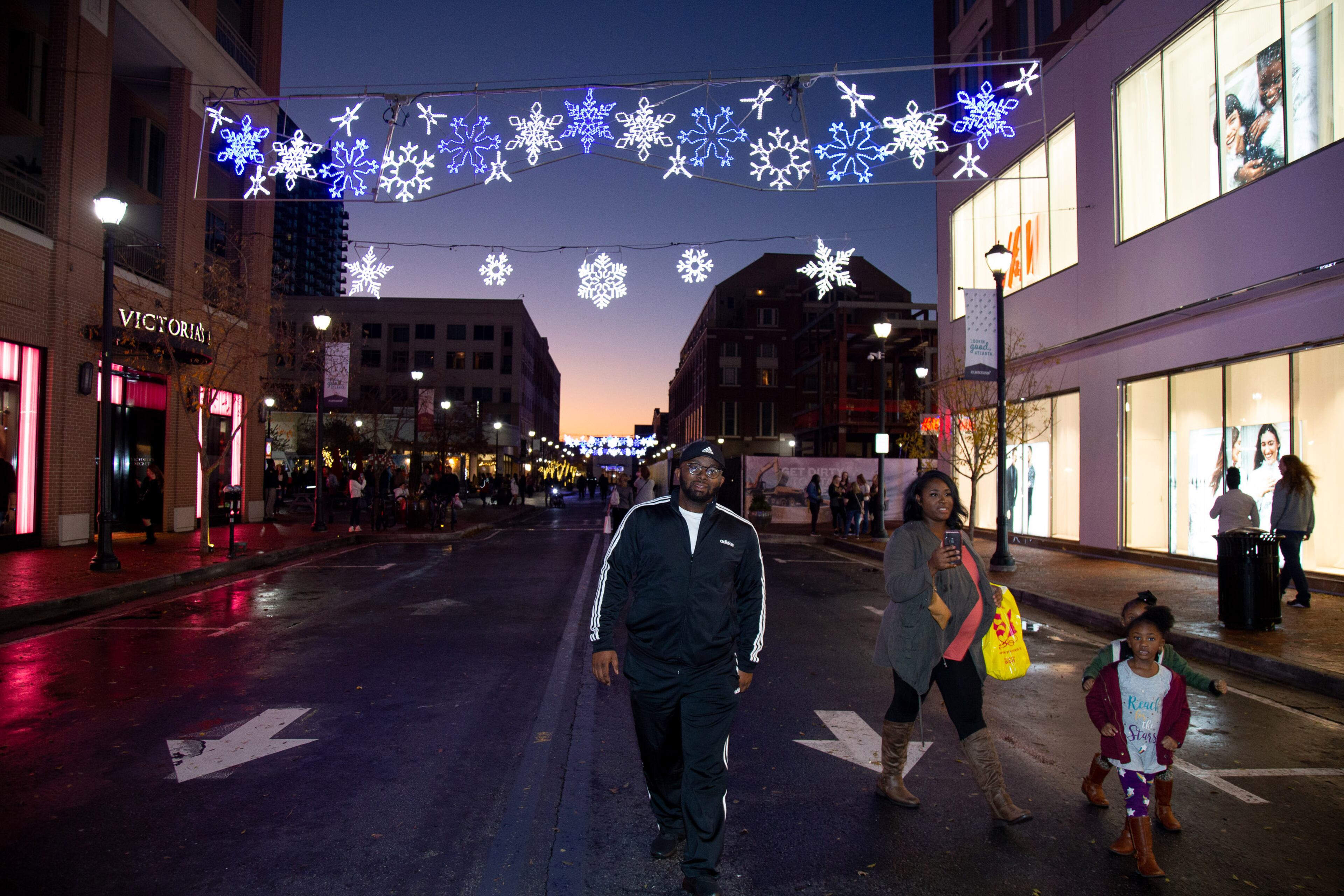 People walk down 18th Street during the Lighting of Atlantic Station event Saturday, November 23, 2019. STEVE SCHAEFER / SPECIAL TO THE AJC