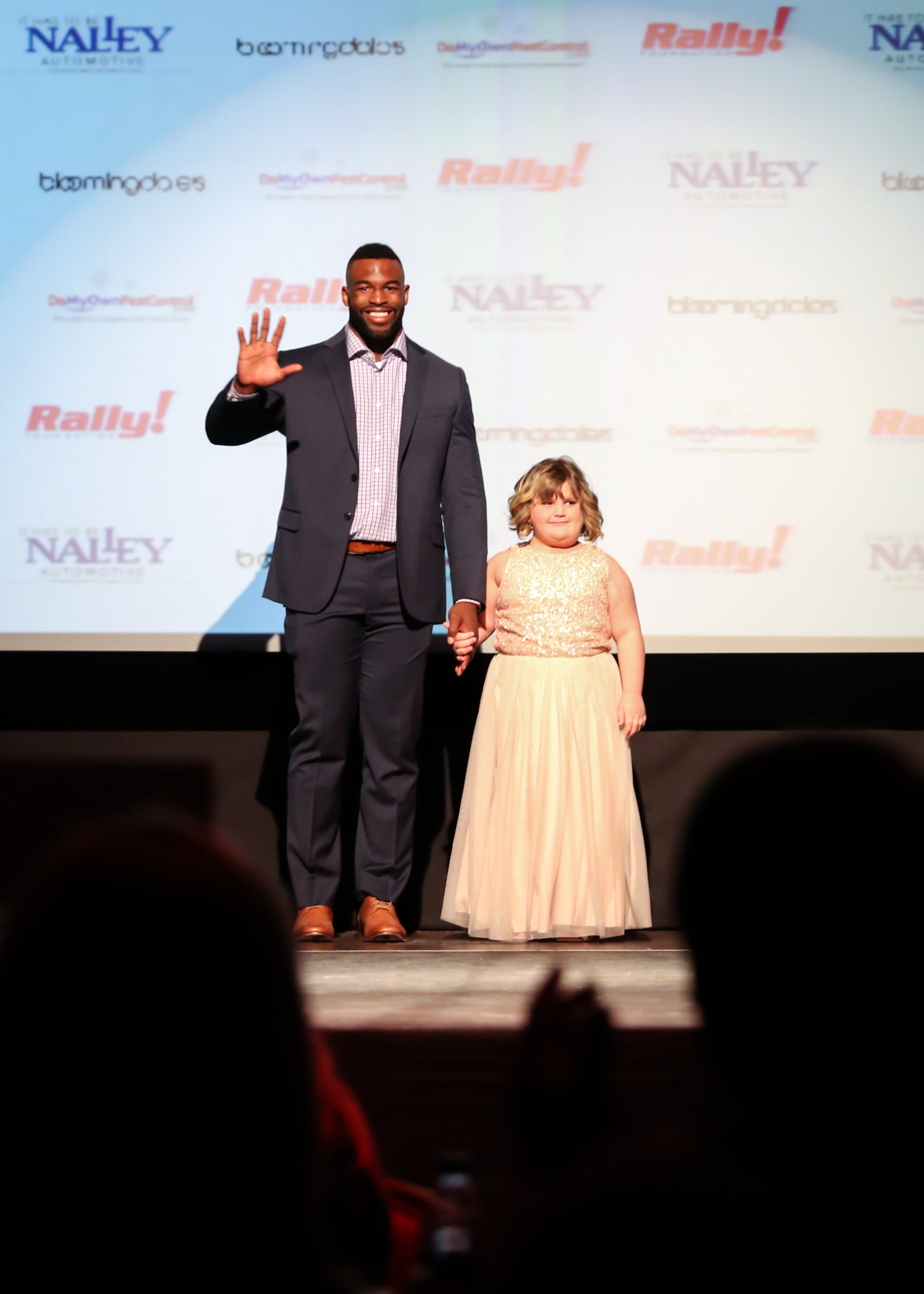 Atlanta Falcons linebacker Jacques Smith escorts Jacelyn in the 6th annual Rally on the Runway fashion show at the Buckhead Theatre on Friday, April 24, 5015. The event helped raise $200,000 for the Rally Foundation for Childhood Cancer Research. Photography by Lauren Chambers.