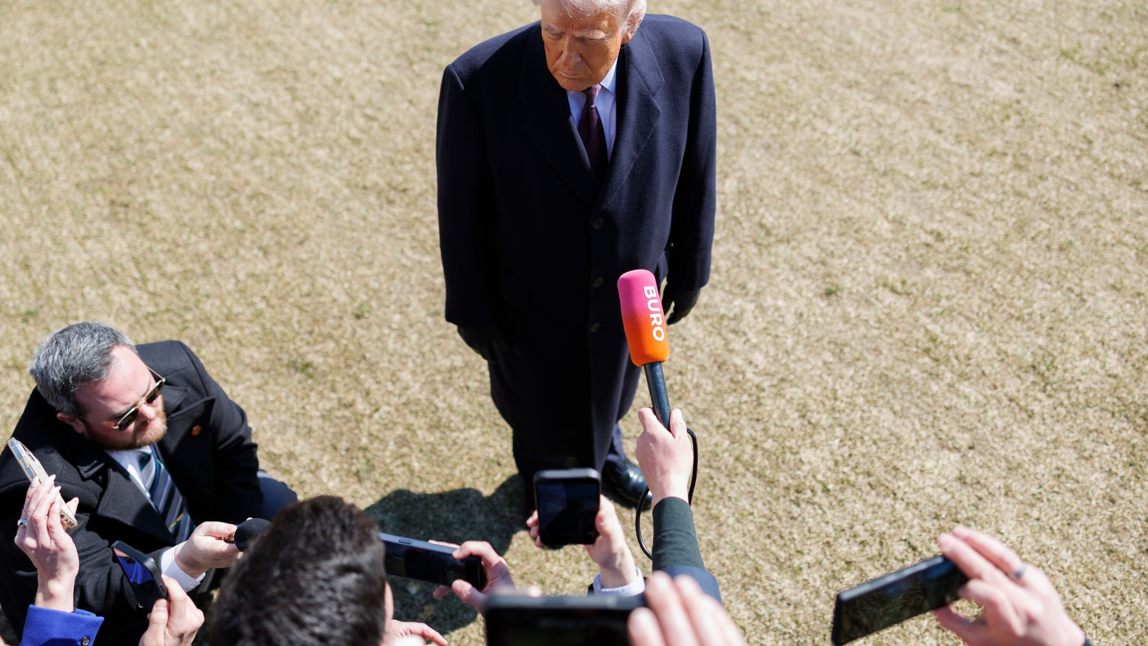 President Donald Trump speaks to reporters before departing on Marine One from the South Lawn of the White House, Friday, Feb. 27, 2026, in Washington. (AP Photo/Tom Brenner)