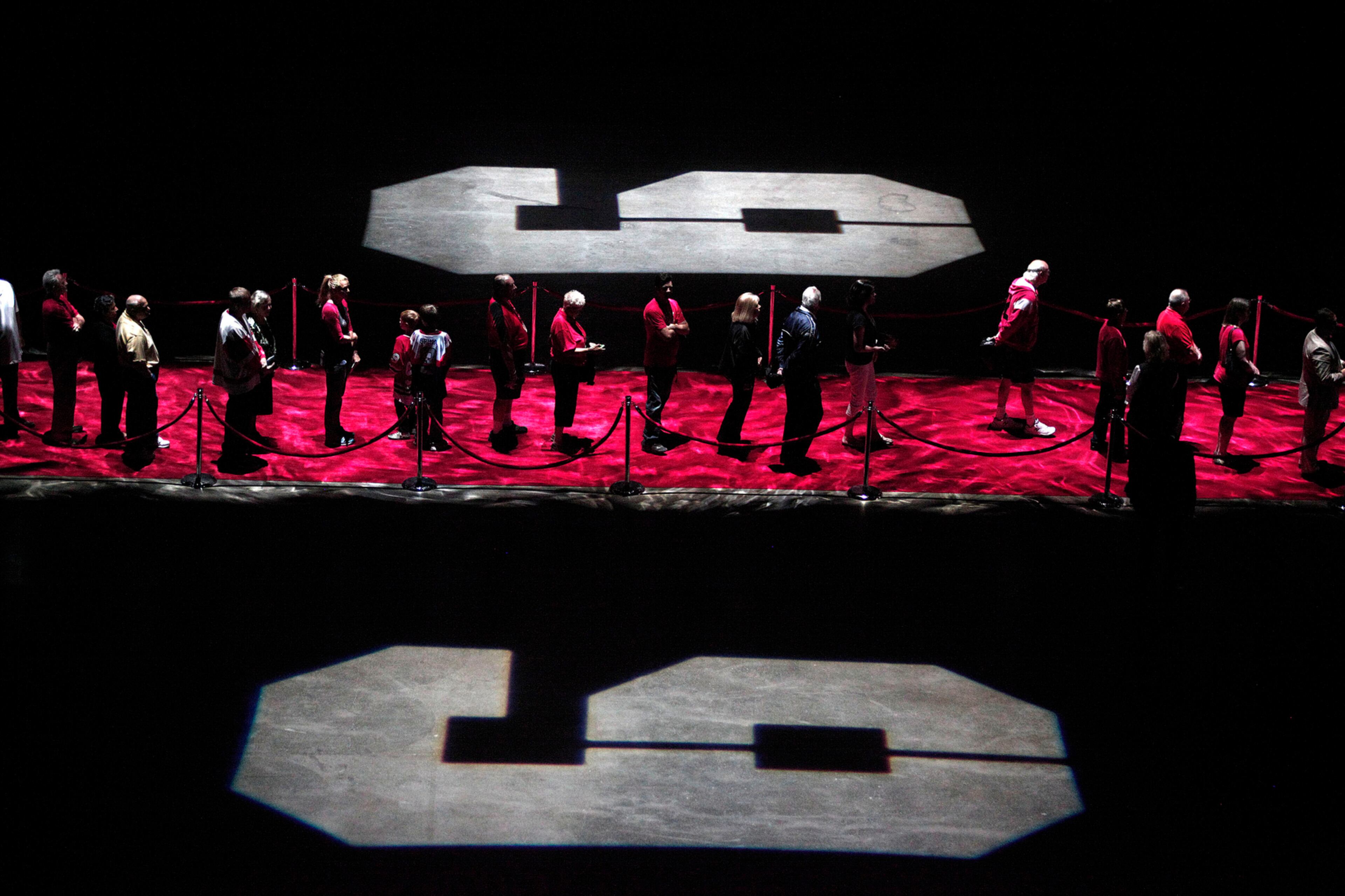 FINAL RESPECTS--DETROIT, MI - JUNE 14: Mourners and NHL fans pay their respects to legendary hockey Hall of Famer Gordie Howe at his visitation at Joe Louis Arena June 14, 2016 in Detroit Michigan. Howe was known as "Mr. Hockey", played for the Detroit Red Wings for 25 years, and scored 801 goals in his career. His funeral service will be held June 15 at the Cathedral of the Most Blessed Sacrament in Detroit. (Photo by Bill Pugliano/Getty Images) *** BESTPIX ***