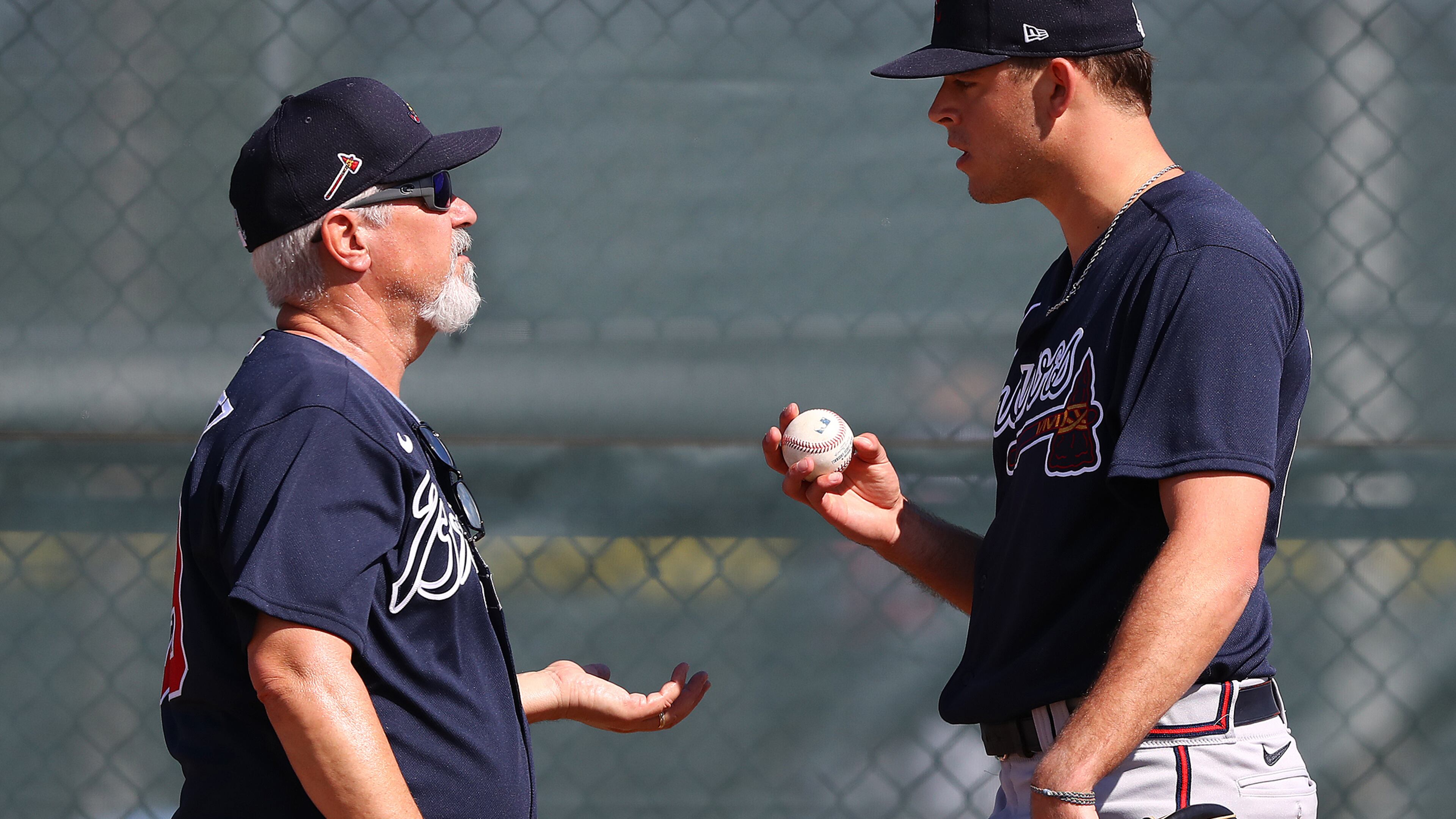 Braves pitcher Jeremy Walker confers with pitching coach Rick Kranitz during a pitching session Sunday, Feb. 16, 2020, at CoolToday Park in North Port, Fla.