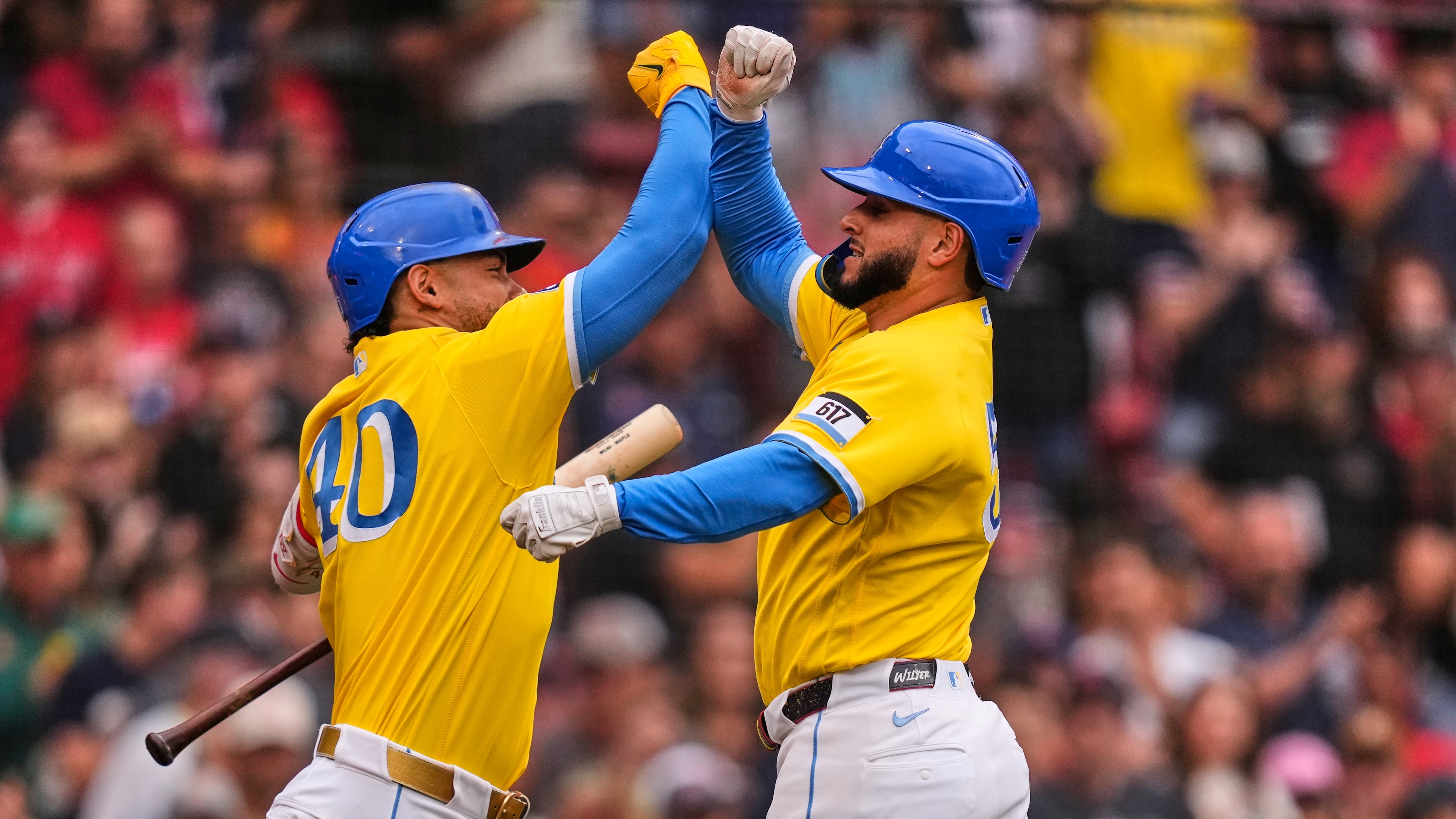 Boston Red Sox's Wilyer Abreu, right, is congratulated by Willson Contreras after hitting a solo home run in the third inning of a baseball game against the Tampa Bay Rays, Saturday, July 18, 2026, in Boston. (AP Photo/Charles Krupa)