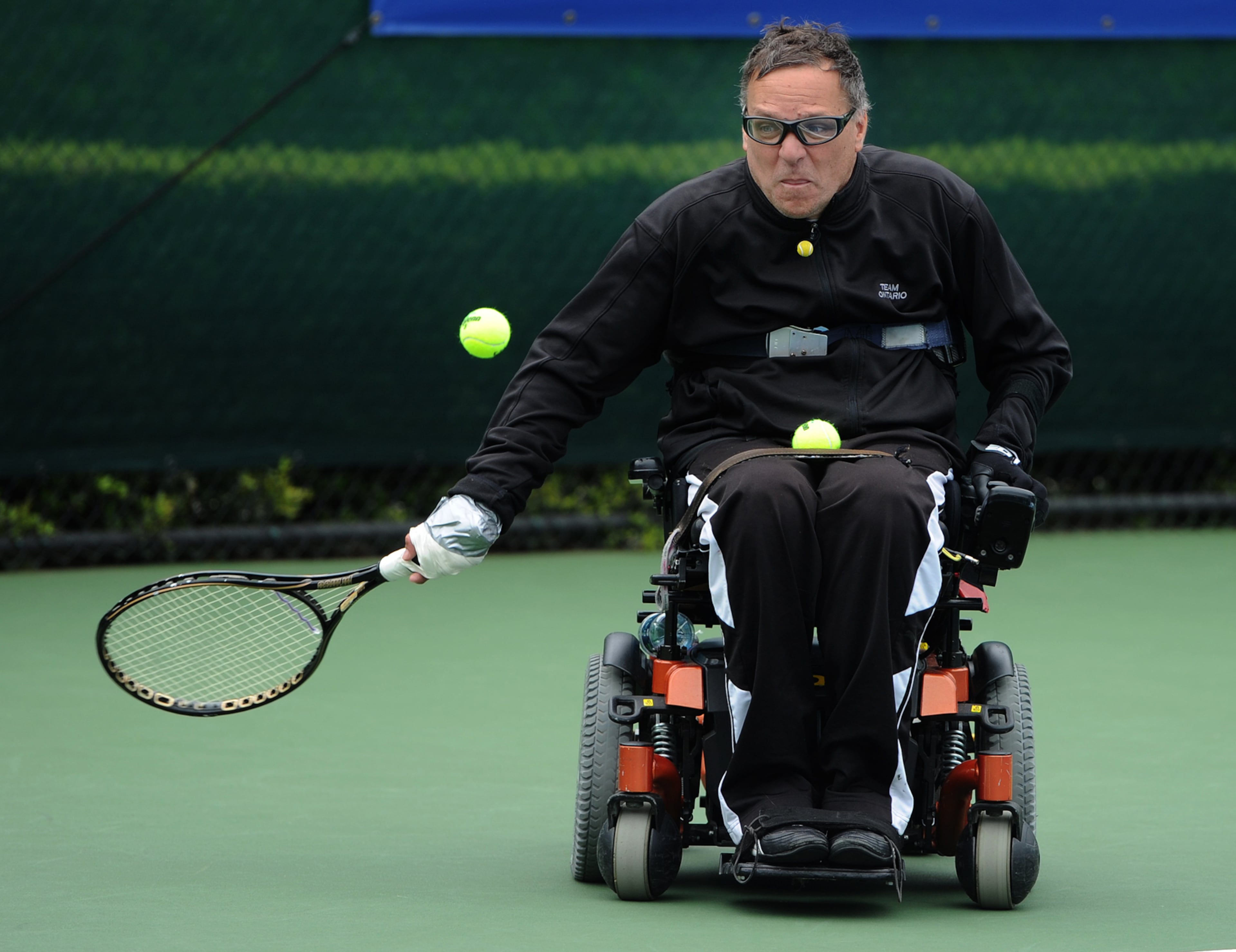Adrian Dieleman serves the ball during the Atlanta Open Wheelchair Tennis Championships at the Dunwoody Country Club on Wednesday, May 1, 2013. He won his doubles match in the quad division. JOHNNY CRAWFORD / JCRAWFORD@AJC.COM