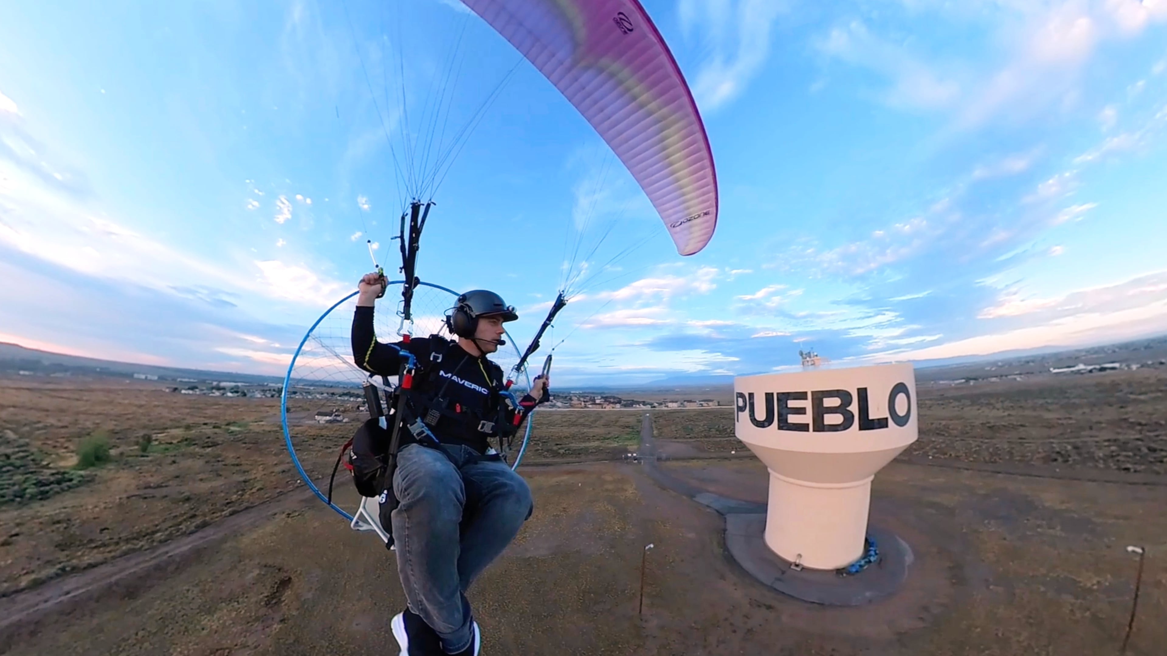 In this image taken from video provided by Jacob Hutzler shows Hutzler flies his paramotor to work as an air traffic controller in Pueblo, Colo., on Aug. 13, 2026. (Jacob Hutzler via AP)