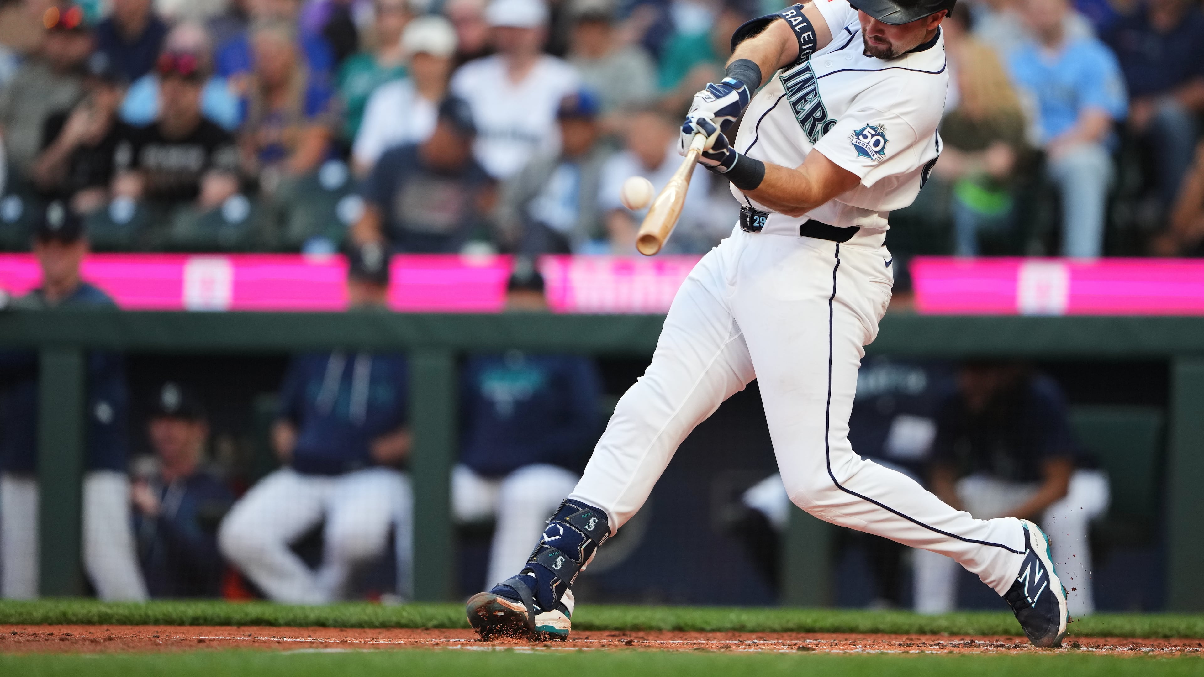 Seattle Mariners' Cal Raleigh hits a two-run home run against the Philadelphia Phillies during the first inning of a baseball game, Monday, Aug. 24, 2026, in Seattle. (AP Photo/Lindsey Wasson)