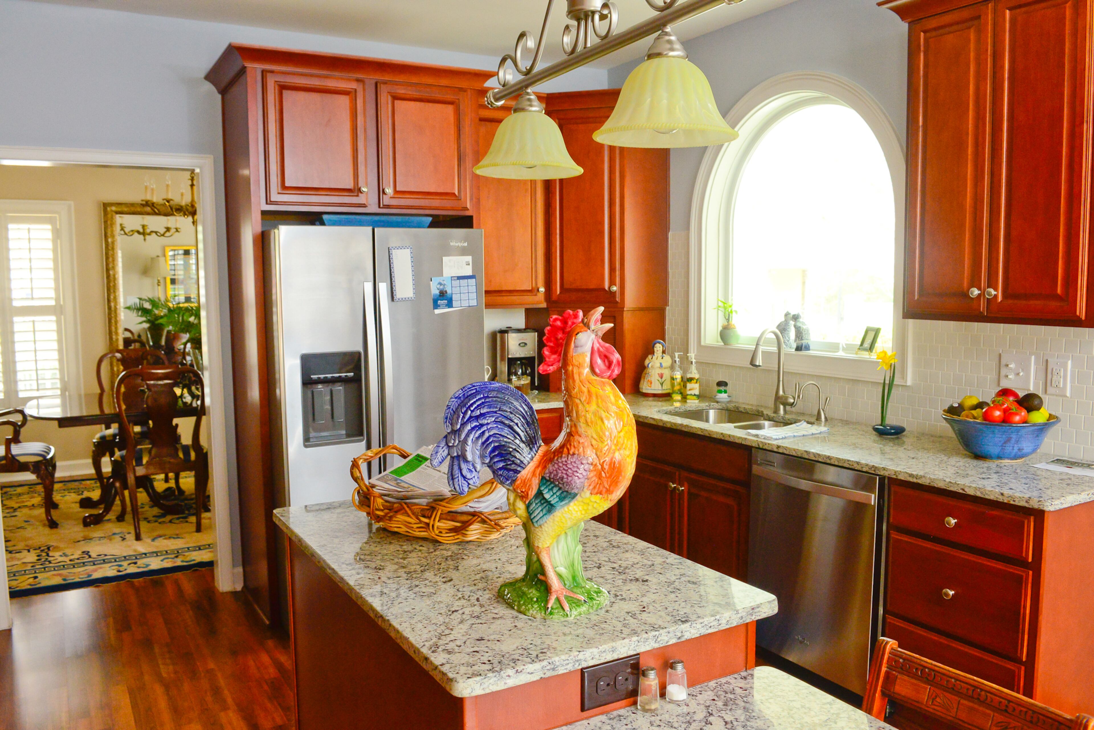 A colorful rooster adds a touch of country charm to the kitchen. The couple found the statue in a gift shop in Birmingham.