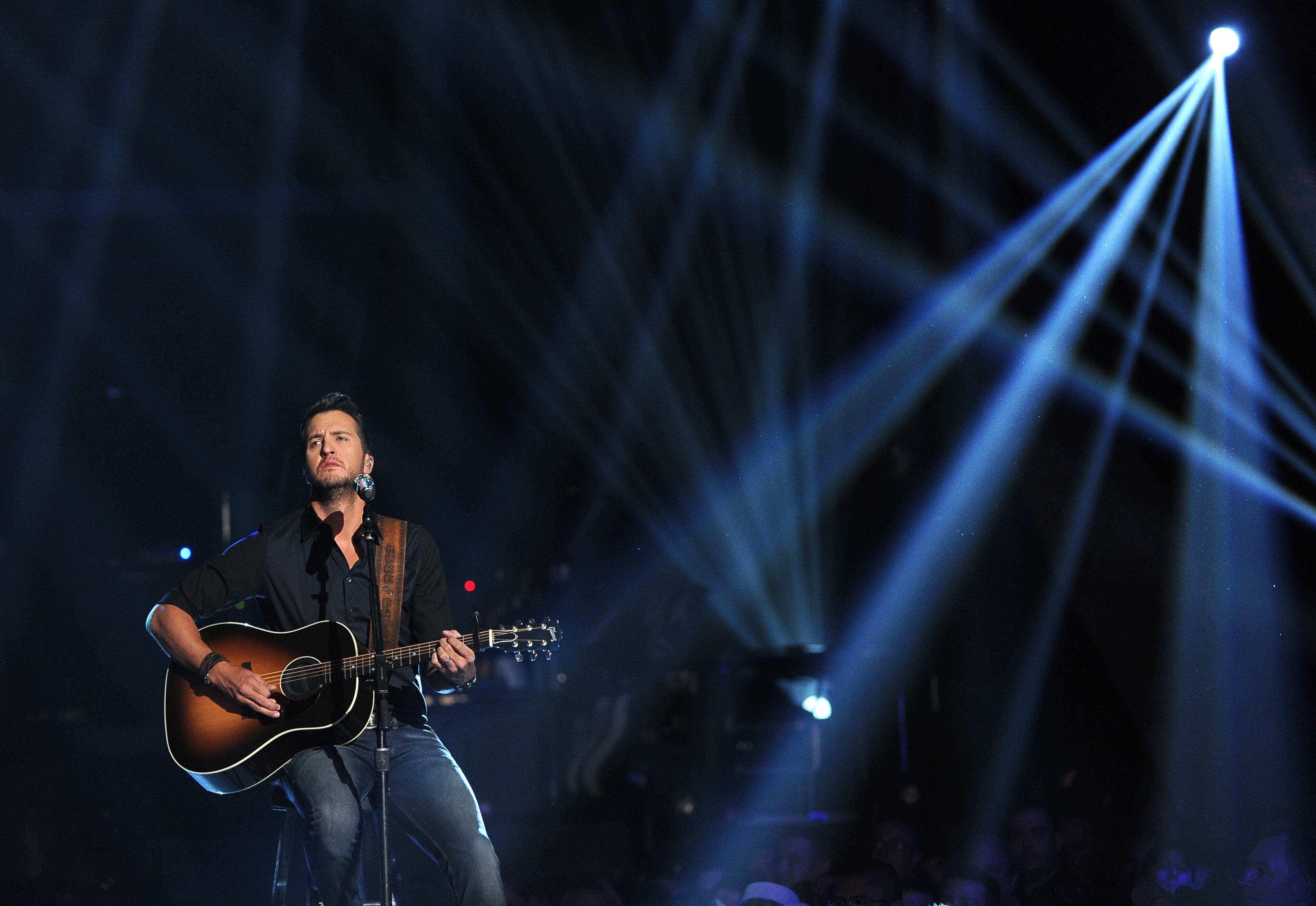 Luke Bryan performs at ACM Presents an All-Star Salute to the Troops on Monday, April 7, 2014, in Las Vegas. (Photo by Chris Pizzello/Invision/AP)