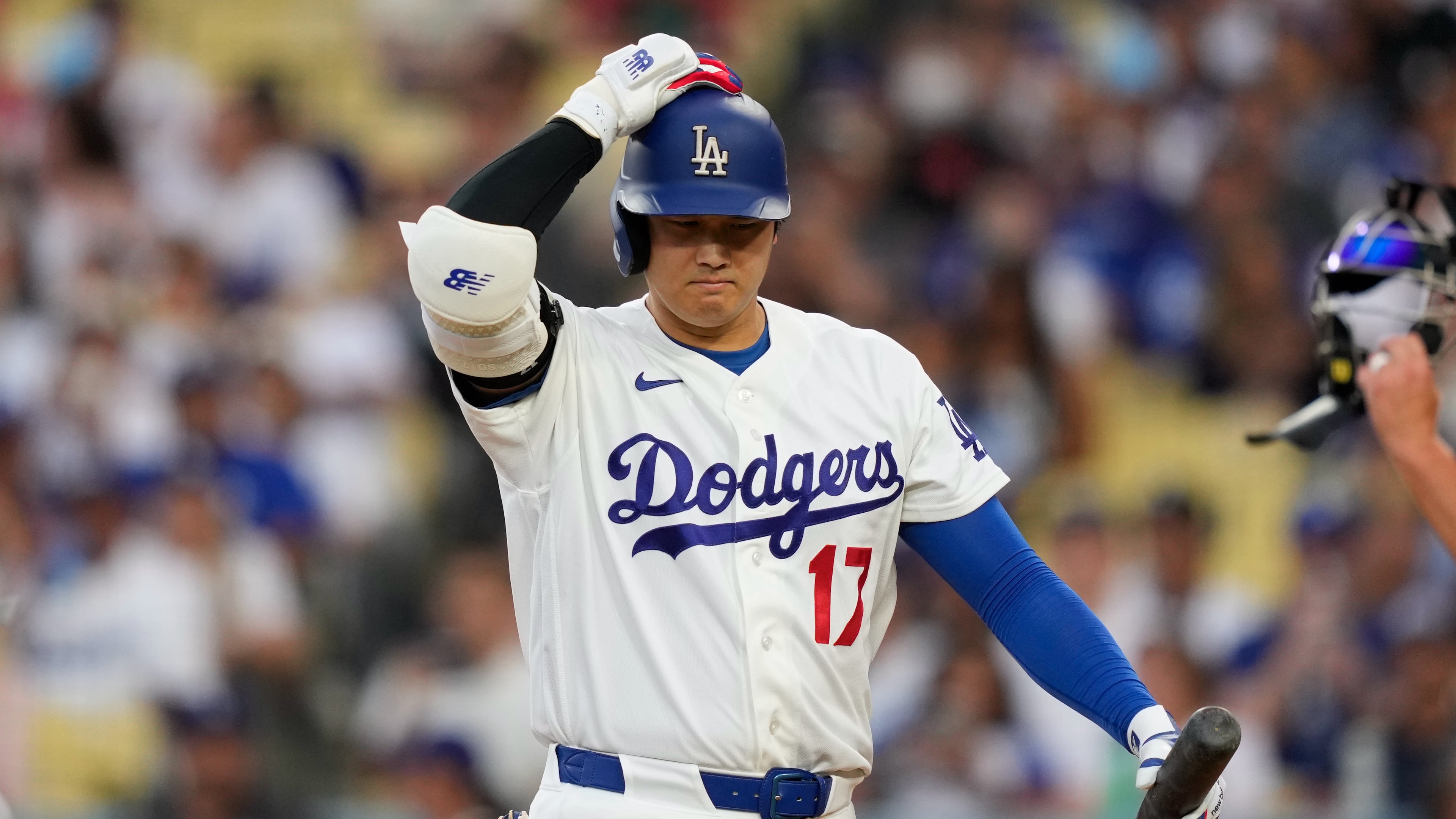Los Angeles Dodgers' Shohei Ohtani walks back to the dugout after striking out as during the third inning of a baseball game against the Cincinnati Reds, Monday, Sept. 7, 2026, in Los Angeles. (AP Photo/Mark J. Terrill)