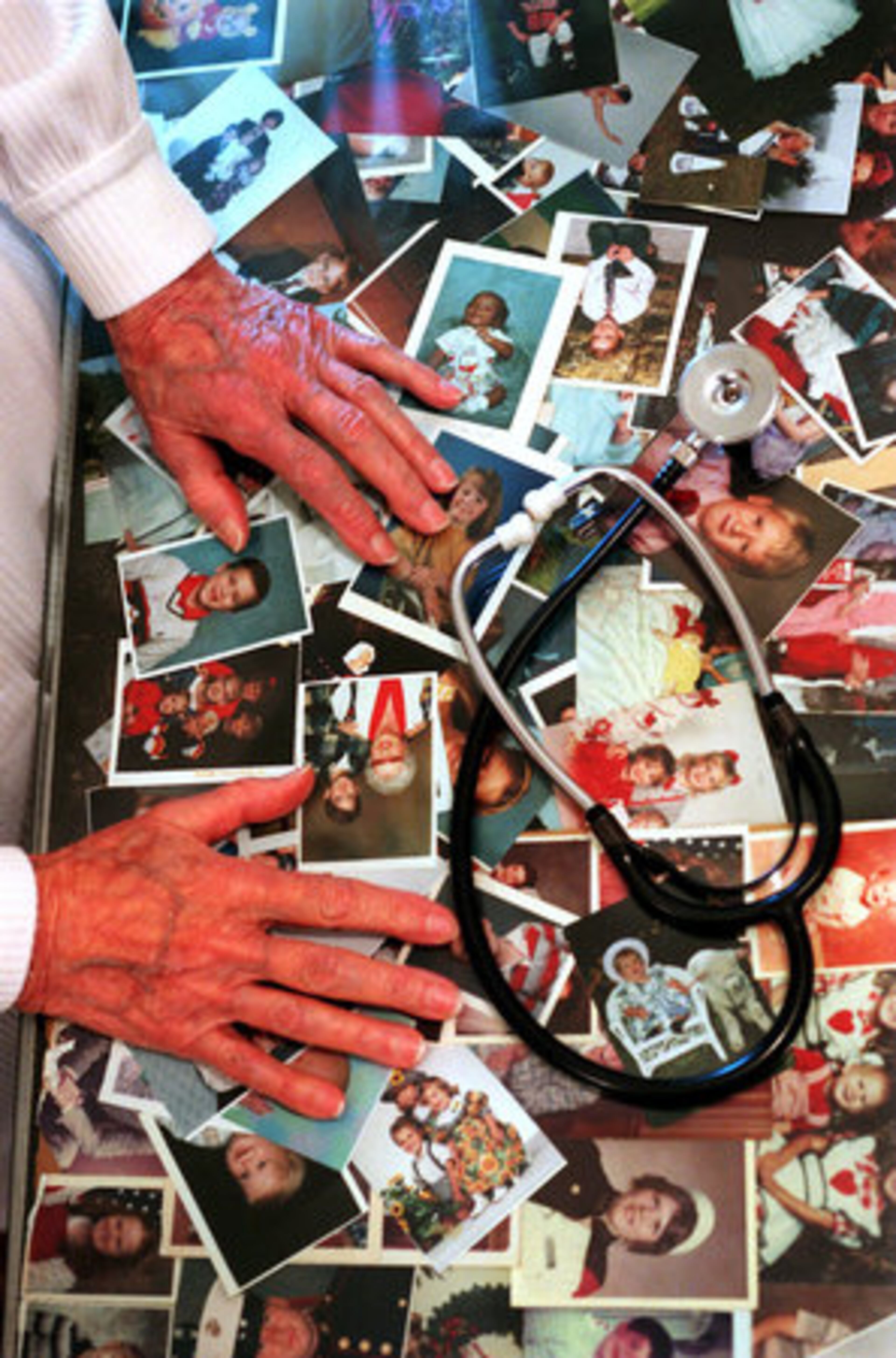 Hundreds of photographs of patients spanning her 70-year-career covered Denmark's desktop.