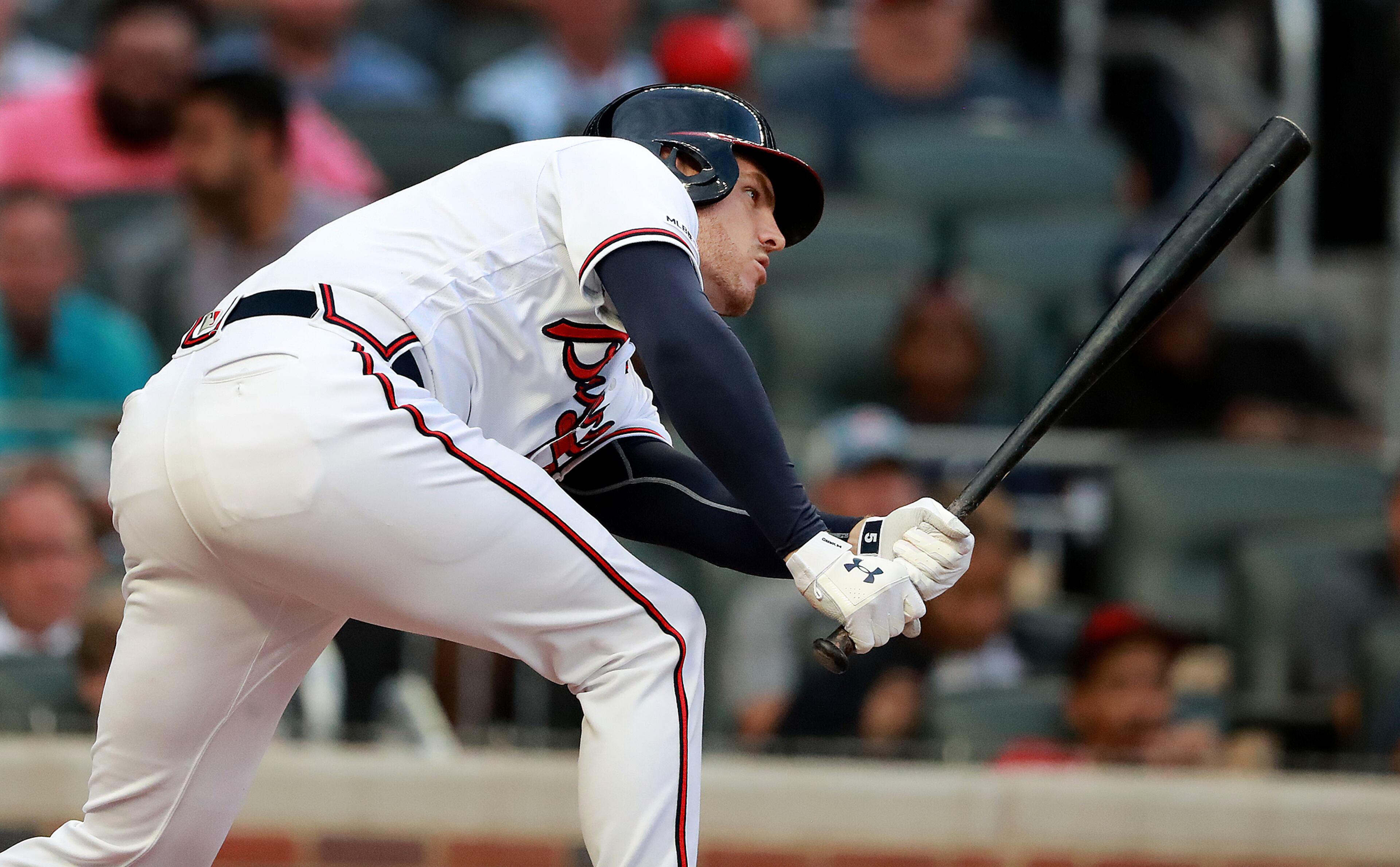 Braves' Freddie Freeman uses some body english as he hits a double. Curtis Compton/ccompton@ajc.com