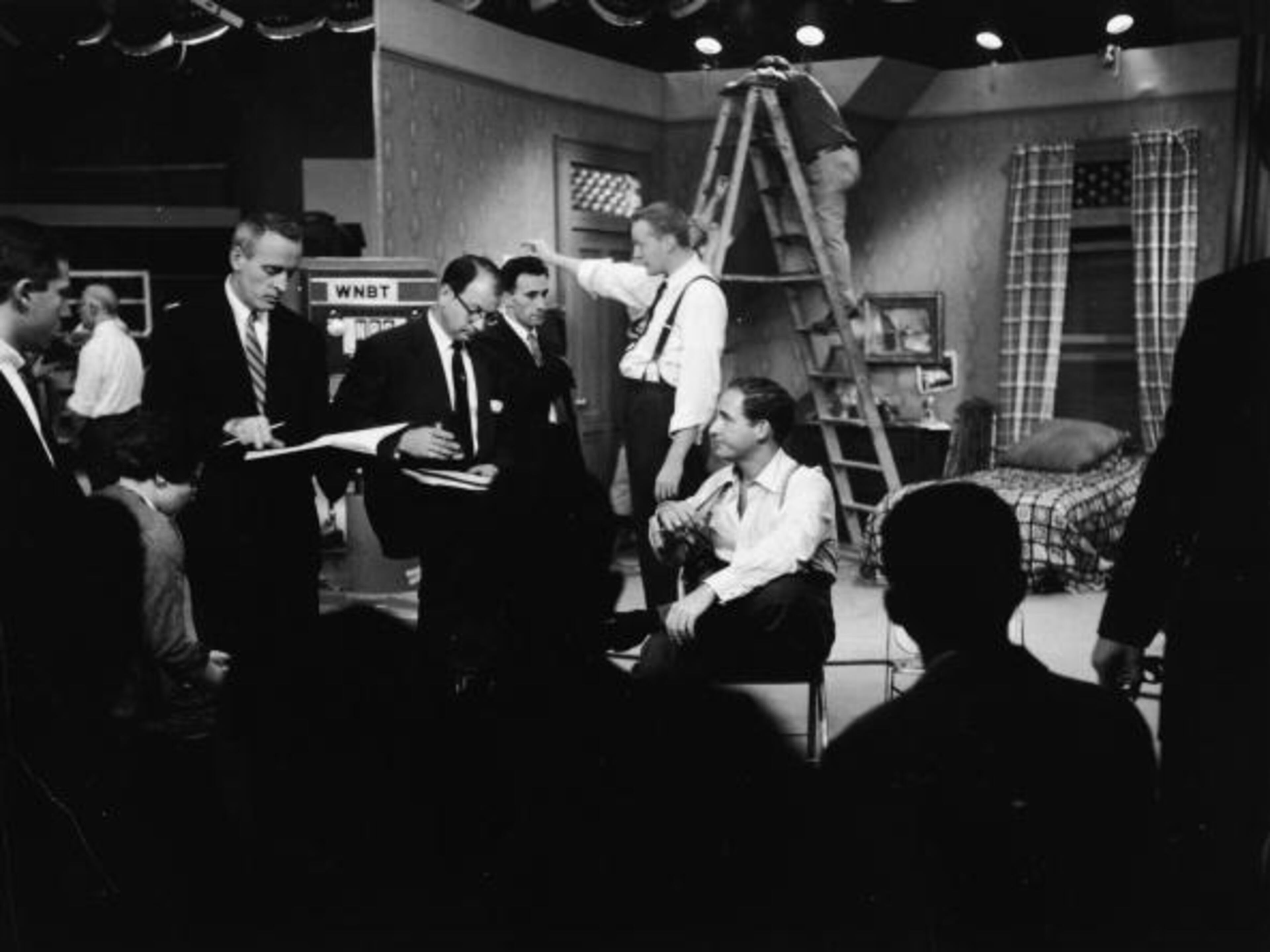 American comedian Sid Caesar sits and speaks with his writers during rehearsal on the set of his live television sketch comedy series, 'Your Show of Shows,' (Photo by NBC Television/Getty Images)