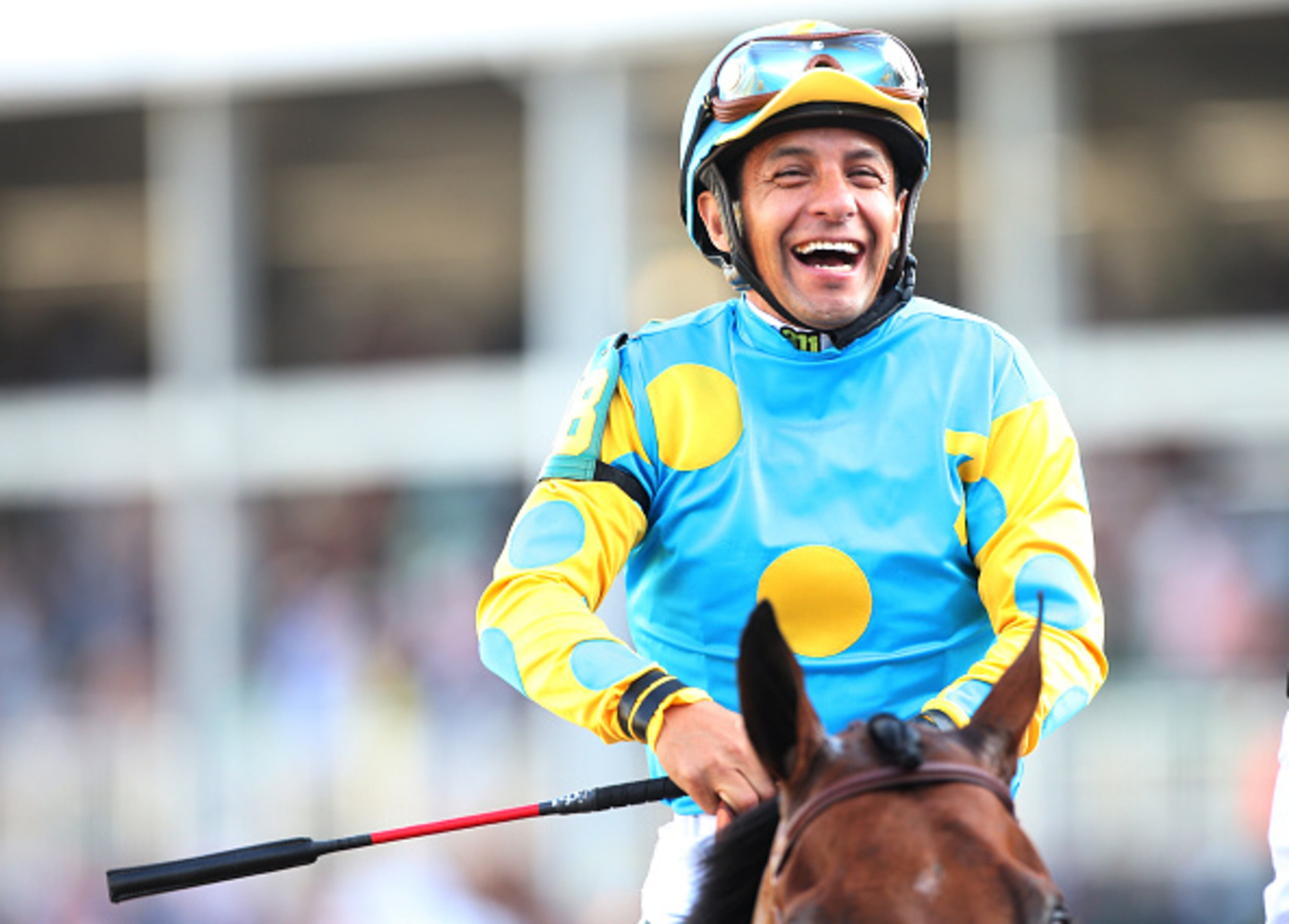 LOUISVILLE, KY - MAY 02: Jockey Victor Espinoza celebrates atop of American Pharoah #18 on his way to winners circle after winning the 141st running of the Kentucky Derby at Churchill Downs on May 2, 2015 in Louisville, Kentucky. (Photo by Chris Graythen/Getty Images)