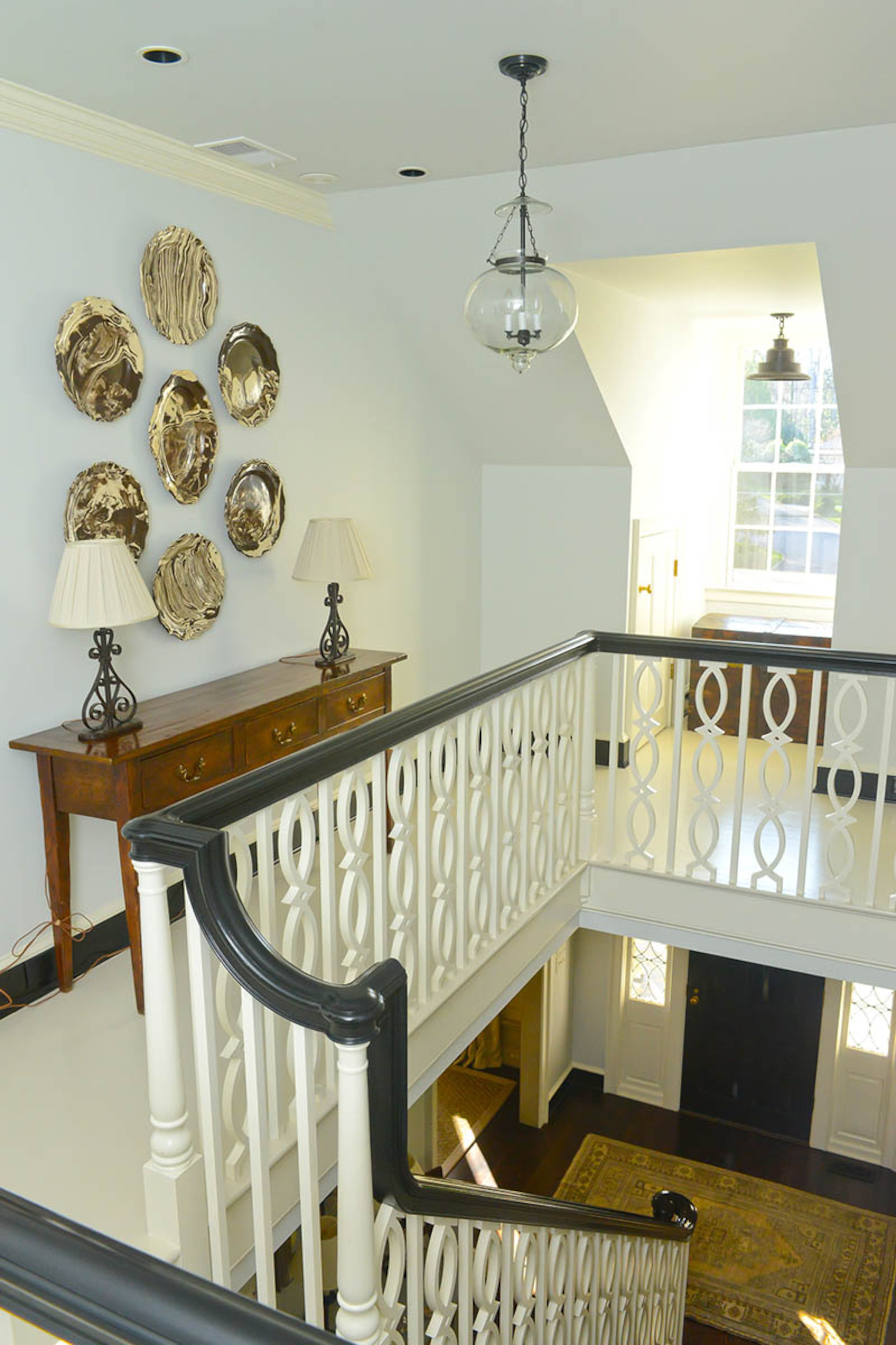Architect William B. Litchfield designed the staircase railings to add visual interest to the space. Johnson also placed several window seats throughout her home, which was renovated in 2015.