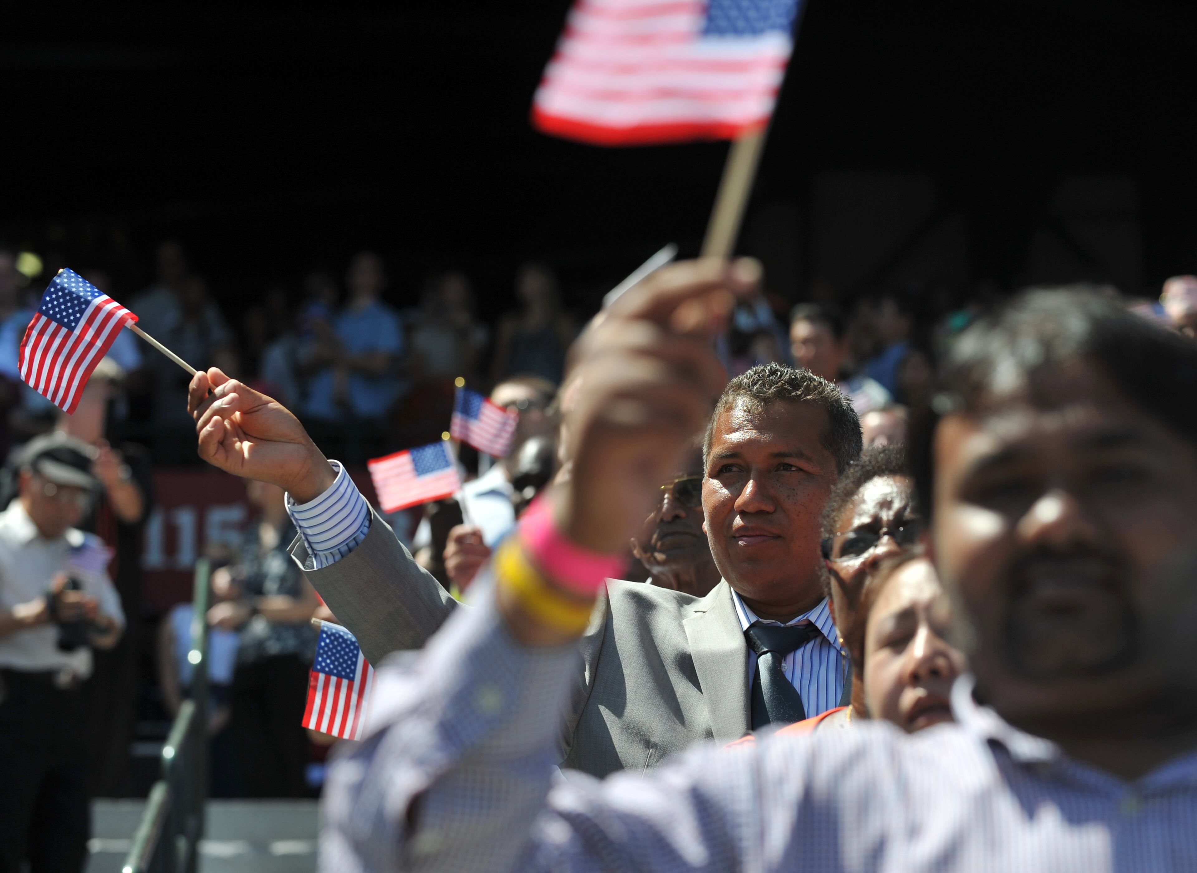 Around 1,000 immigrants officially became citizens of the United States during a naturalization ceremony at Turner Field Wednesday July 2, 2014. BRANT SANDERLIN /BSANDERLIN@AJC.COM.