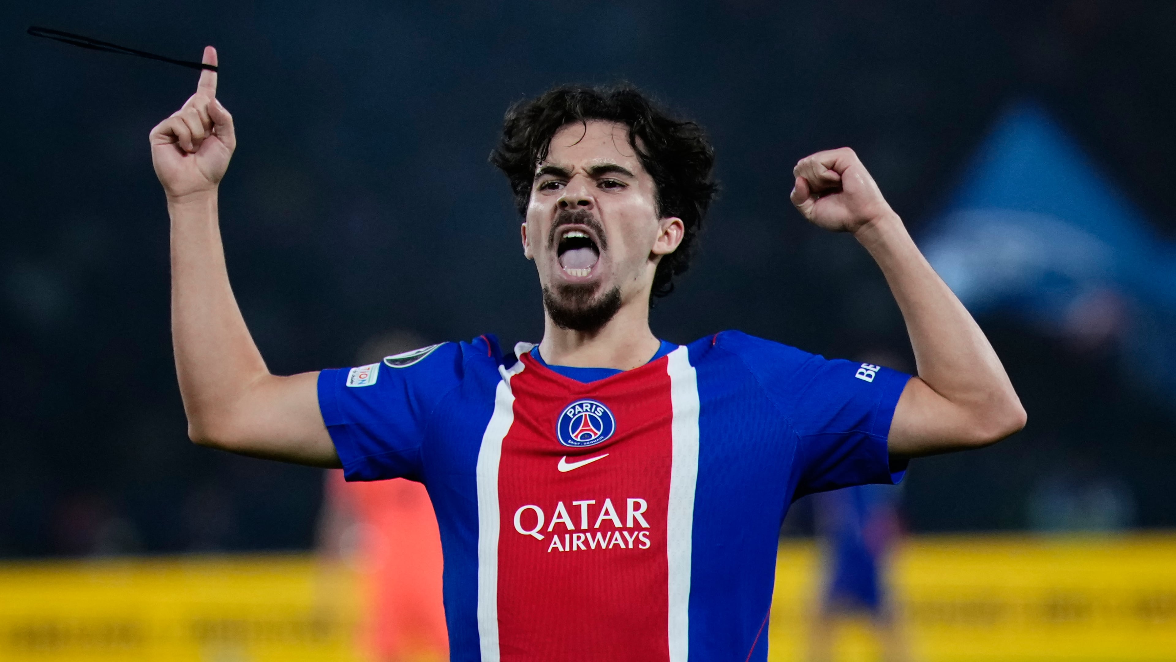 PSG's Vitinha celebrates after scoring his side's third goal during the Champions League opening phase soccer match between Paris Saint-Germain and FC Barcelona in Paris, Tuesday, Oct. 20, 2026. (AP Photo/Teresa Suarez)