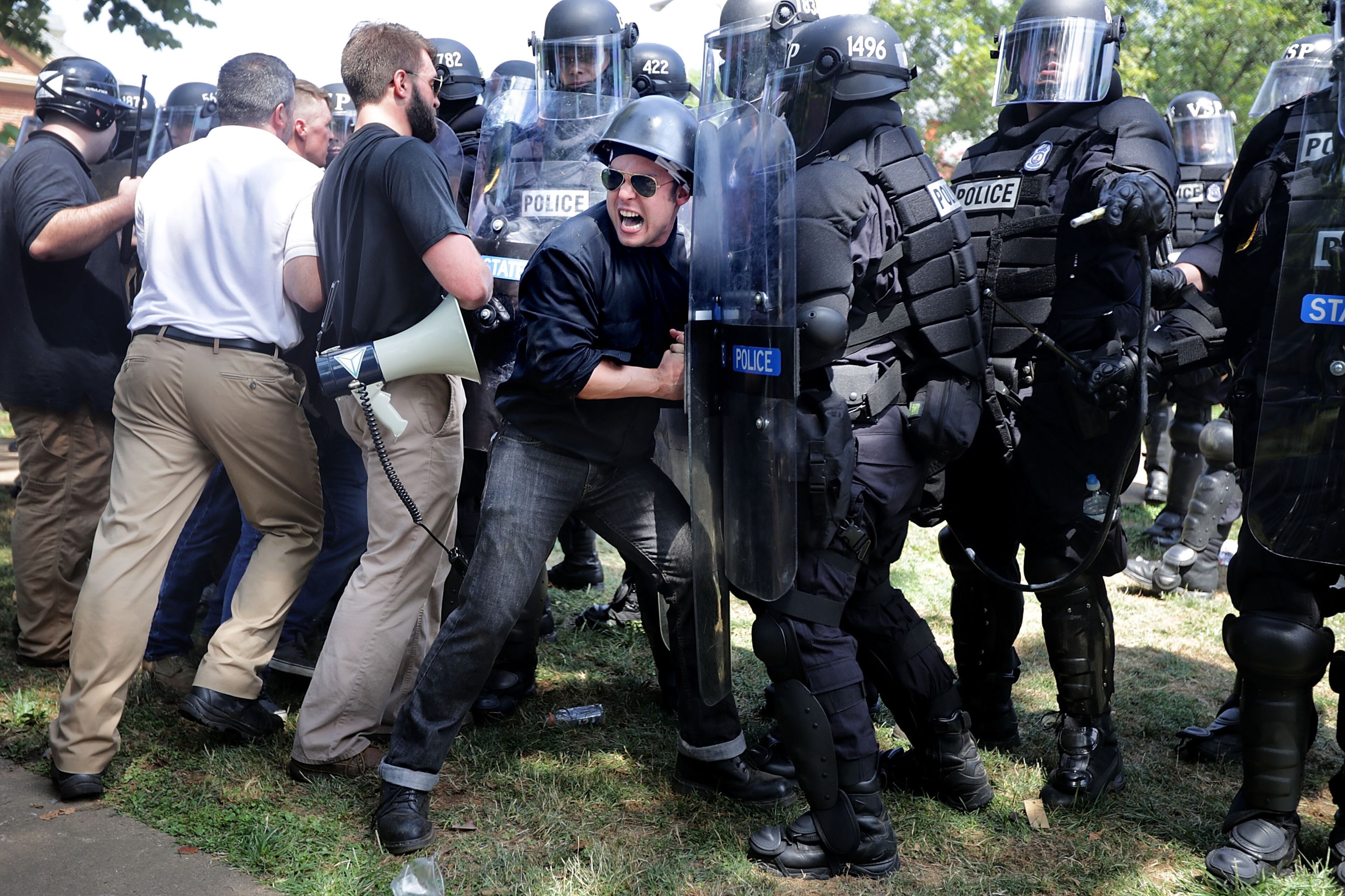 CHARLOTTESVILLE, VA - AUGUST 12: Rescue workers and medics tend to many people who were injured when a car plowed through a crowd of anti-facist counter-demonstrators marching through the downtown shopping district August 12, 2017 in Charlottesville, Virginia. The car plowed through the crowed following the shutdown of the "Unite the Right" rally by police after white nationalists, neo-Nazis and members of the "alt-right" and counter-protesters clashed near Lee Park, where a statue of Confederate General Robert E. Lee is slated to be removed. (Photo by Chip Somodevilla/Getty Images)