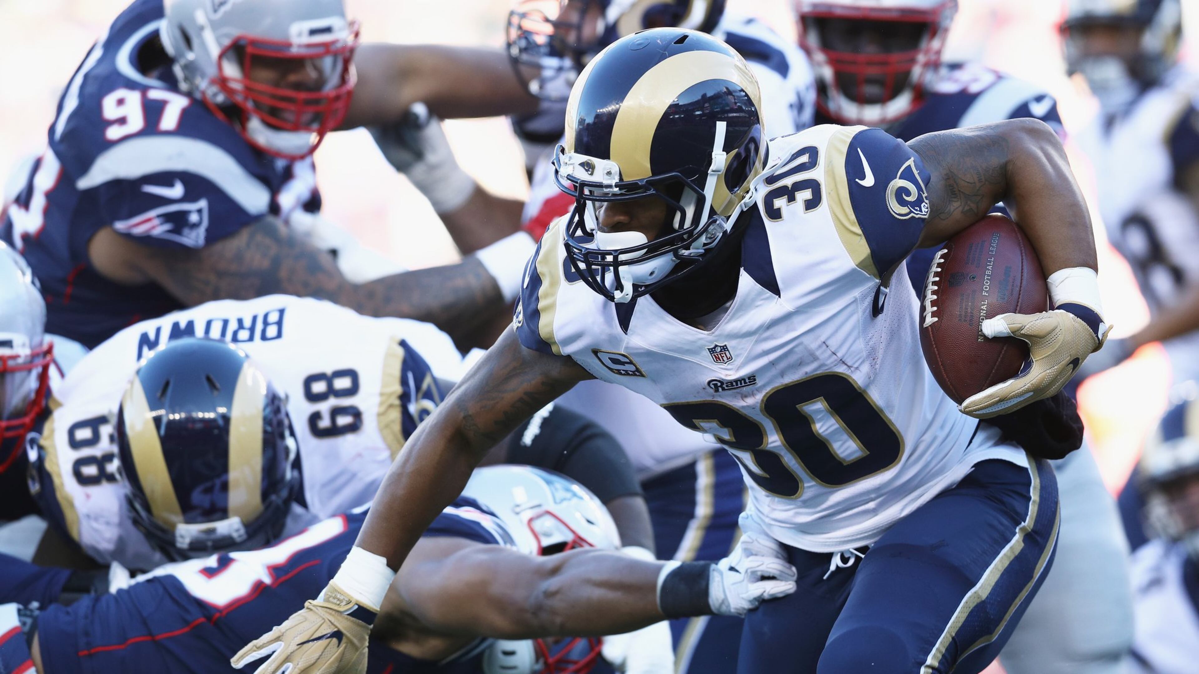 FOXBORO, MA - DECEMBER 04: Todd Gurley #30 of the Los Angeles Rams runs with the ball during the first half against the New England Patriots at Gillette Stadium on December 4, 2016 in Foxboro, Massachusetts. (Photo by Maddie Meyer/Getty Images)