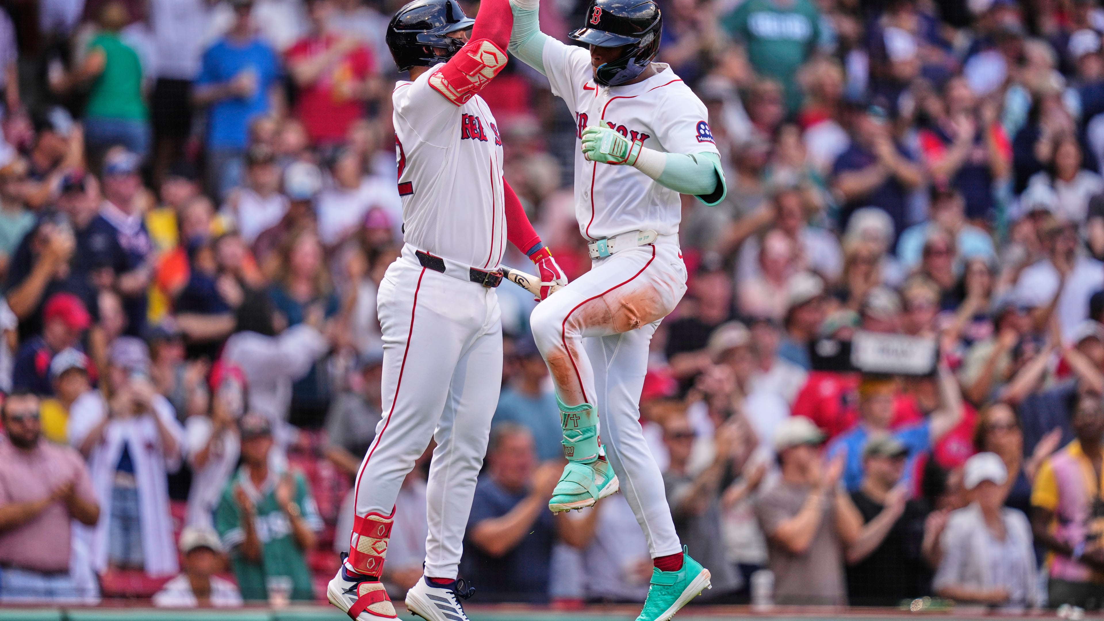 Boston Red Sox's Ceddanne Rafaela, right, is congratulated by Wilyer Abreu after hitting a solo home run in the fourth inning during the first baseball game of a doubleheader against the Baltimore Orioles, Wednesday, July 22, 2026, in Boston. (AP Photo/Charles Krupa)