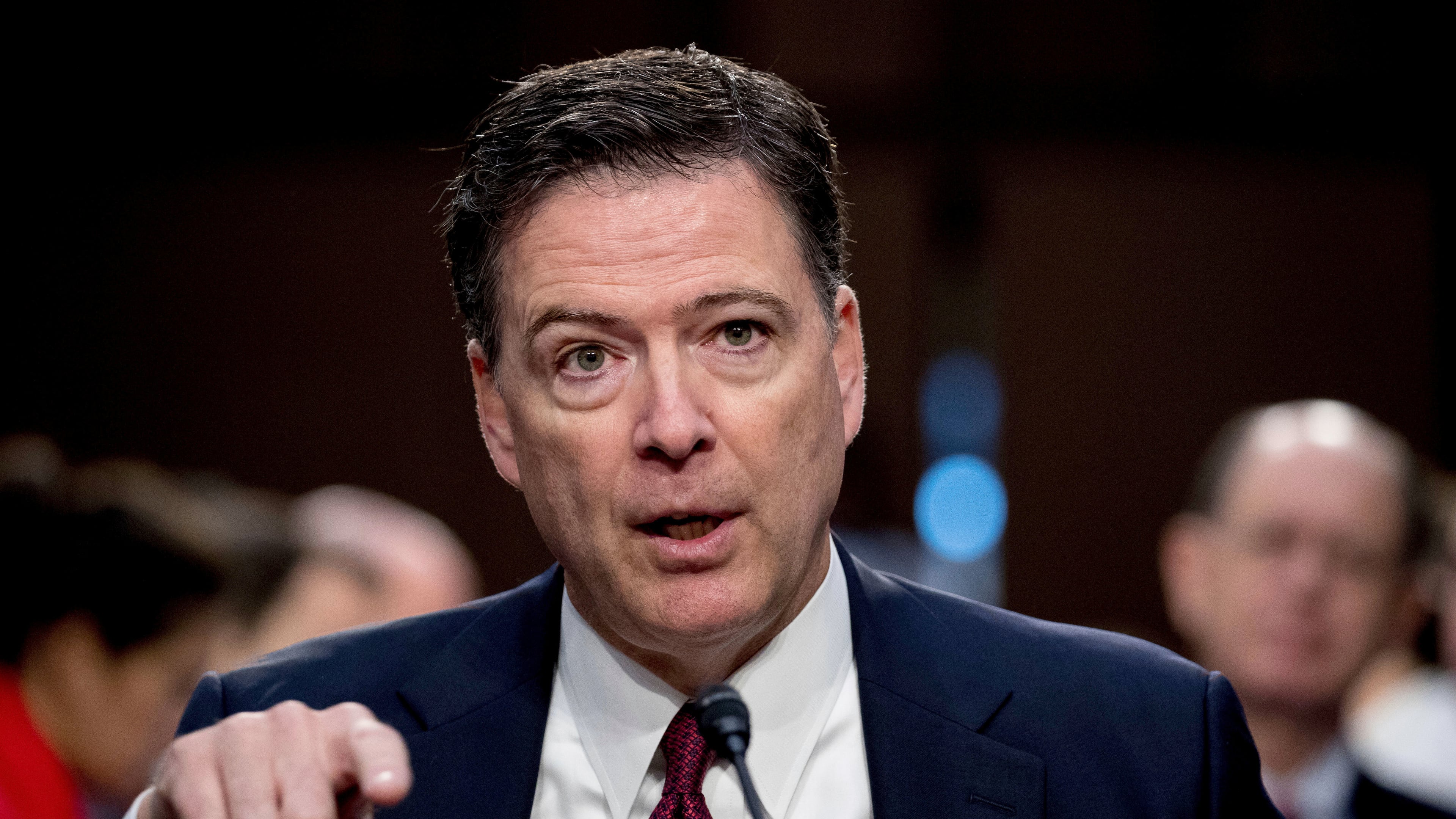 FILE - Former FBI Director James Comey speaks during a Senate Intelligence Committee hearing on Capitol Hill in Washington, June 8, 2017. (AP Photo/Andrew Harnik, File)