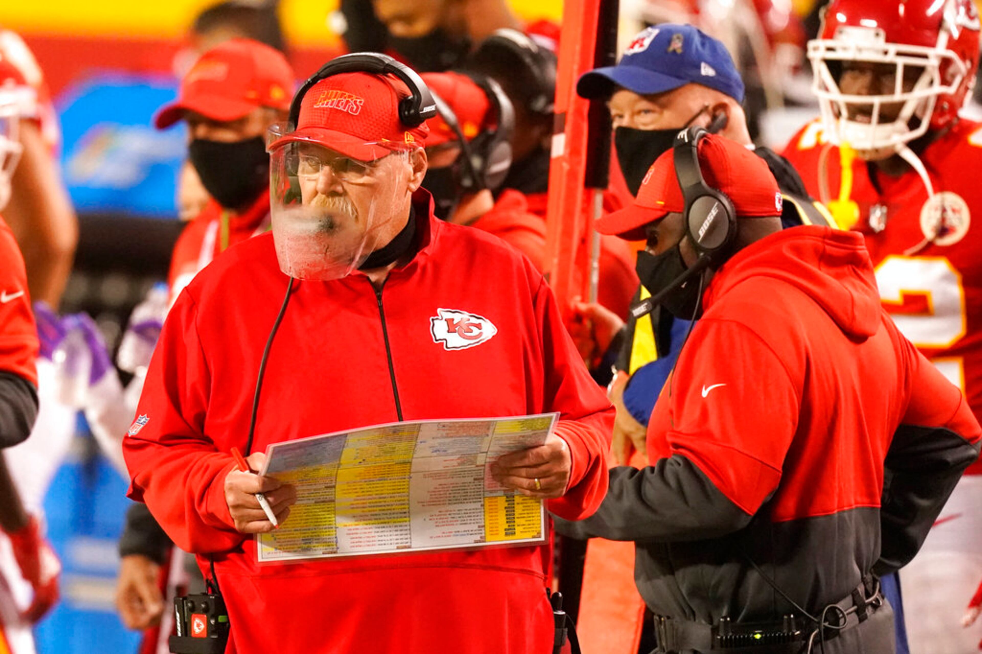 Kansas City Chiefs head coach Andy Reid wears a face shield as he watches from the sideline in the first half of an NFL football game against the Houston Texans Thursday, Sept. 10, 2020, in Kansas City, Mo. The Chiefs won 34-20. (AP Photo/Charlie Riedel)