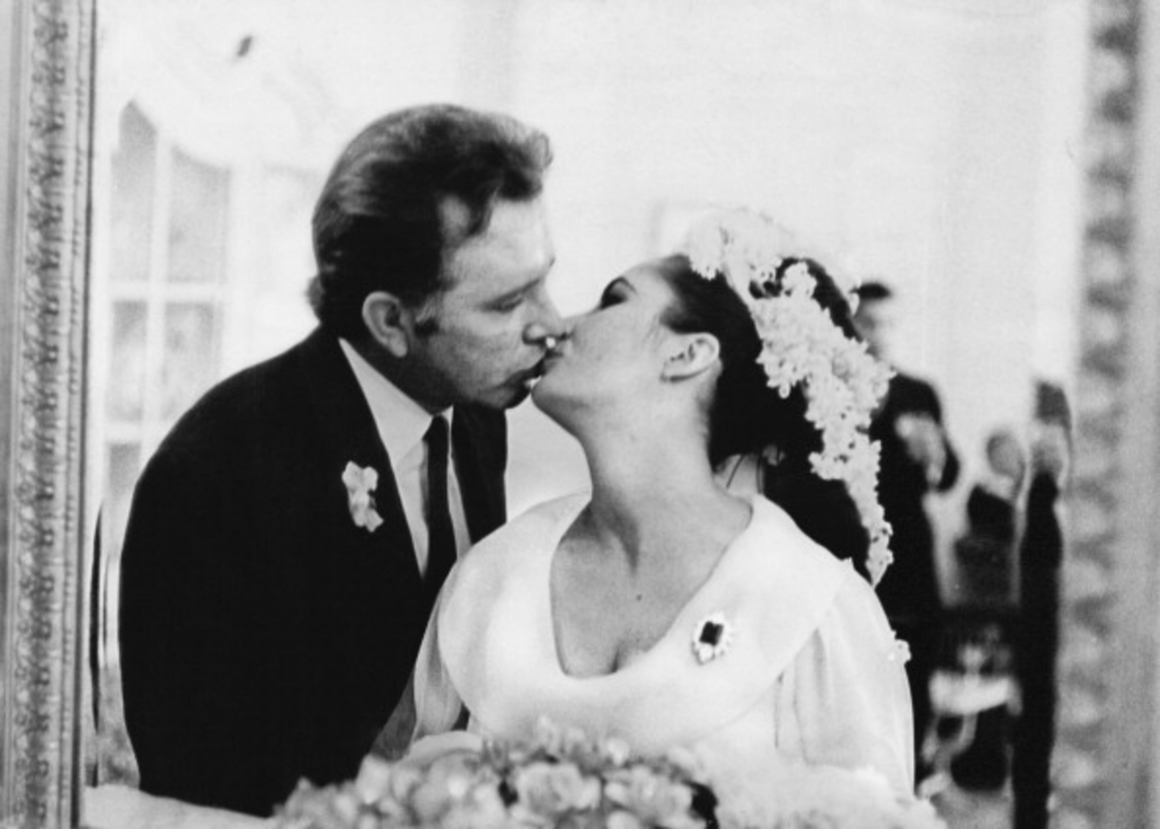 British film stars Elizabeth Taylor (1932-2011) and Richard Burton (1925-1984) at their first wedding in Montreal, Canada on March 15, 1964. They married twice, but both marriages ended in divorce. (Photo by William Lovelace/Evening Standard/Getty Images)