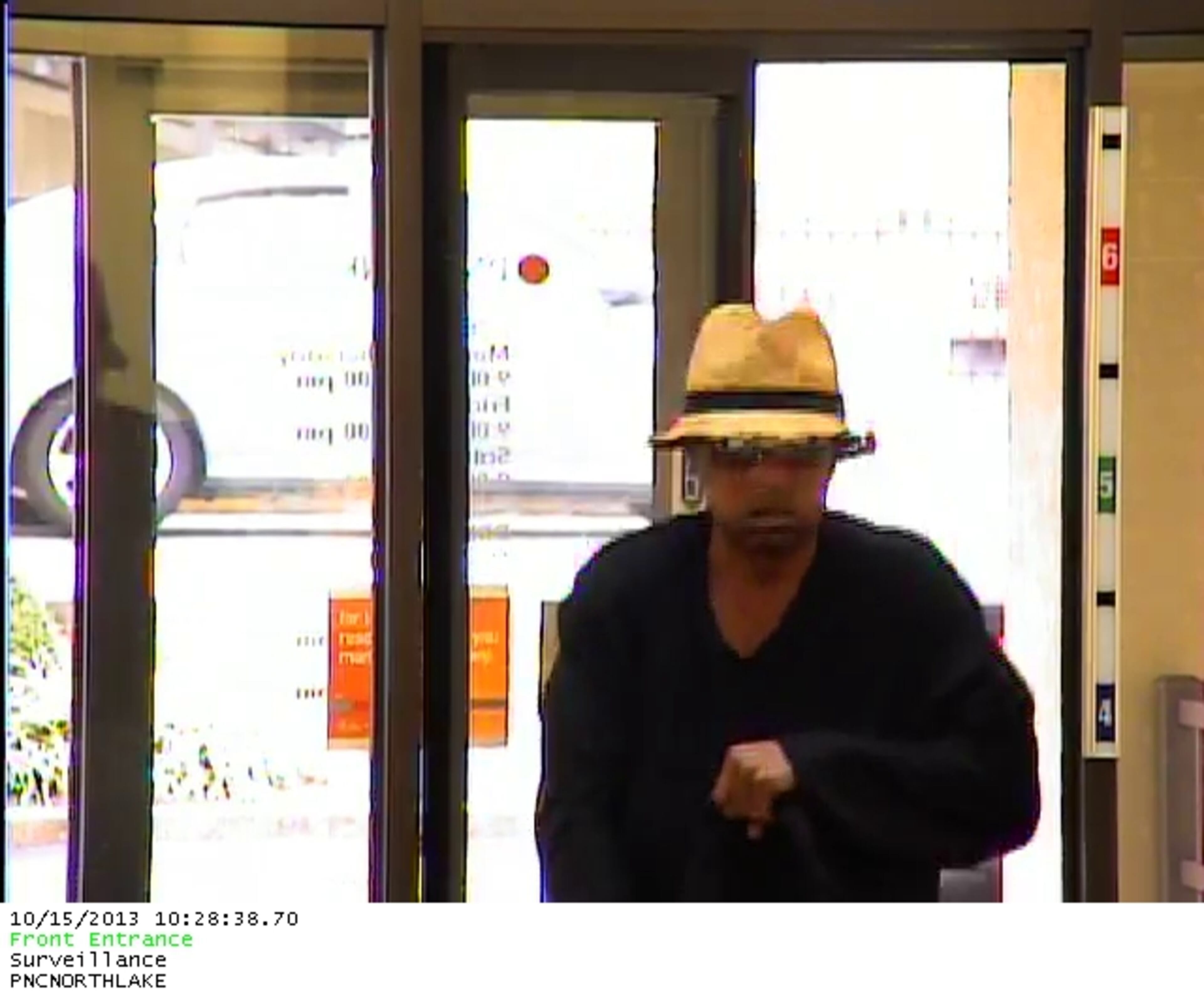 Authorities said a lone black male entered the bank and, while pointing a large framed semi-automatic handgun at a teller, announced a robbery.