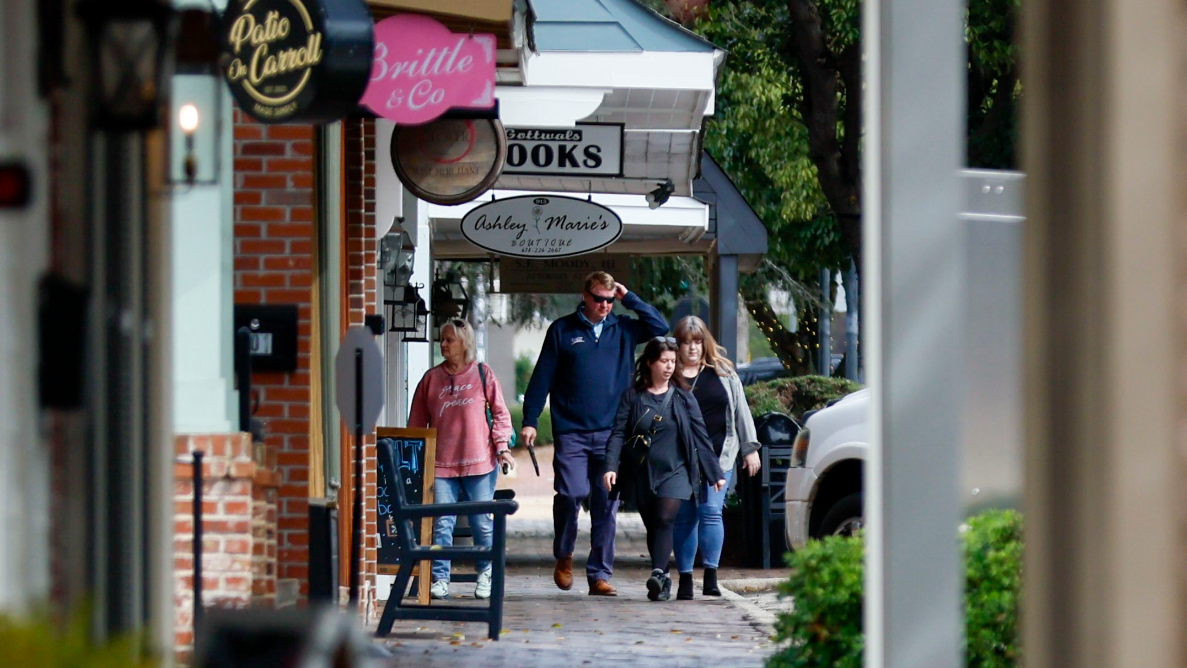 People on Carroll Street in downtown Perry in early February. The variety of businesses and shops is notable here, reflecting the ongoing revival of this 200-year-old city's historic downtown.
(Miguel Martinez/ AJC)