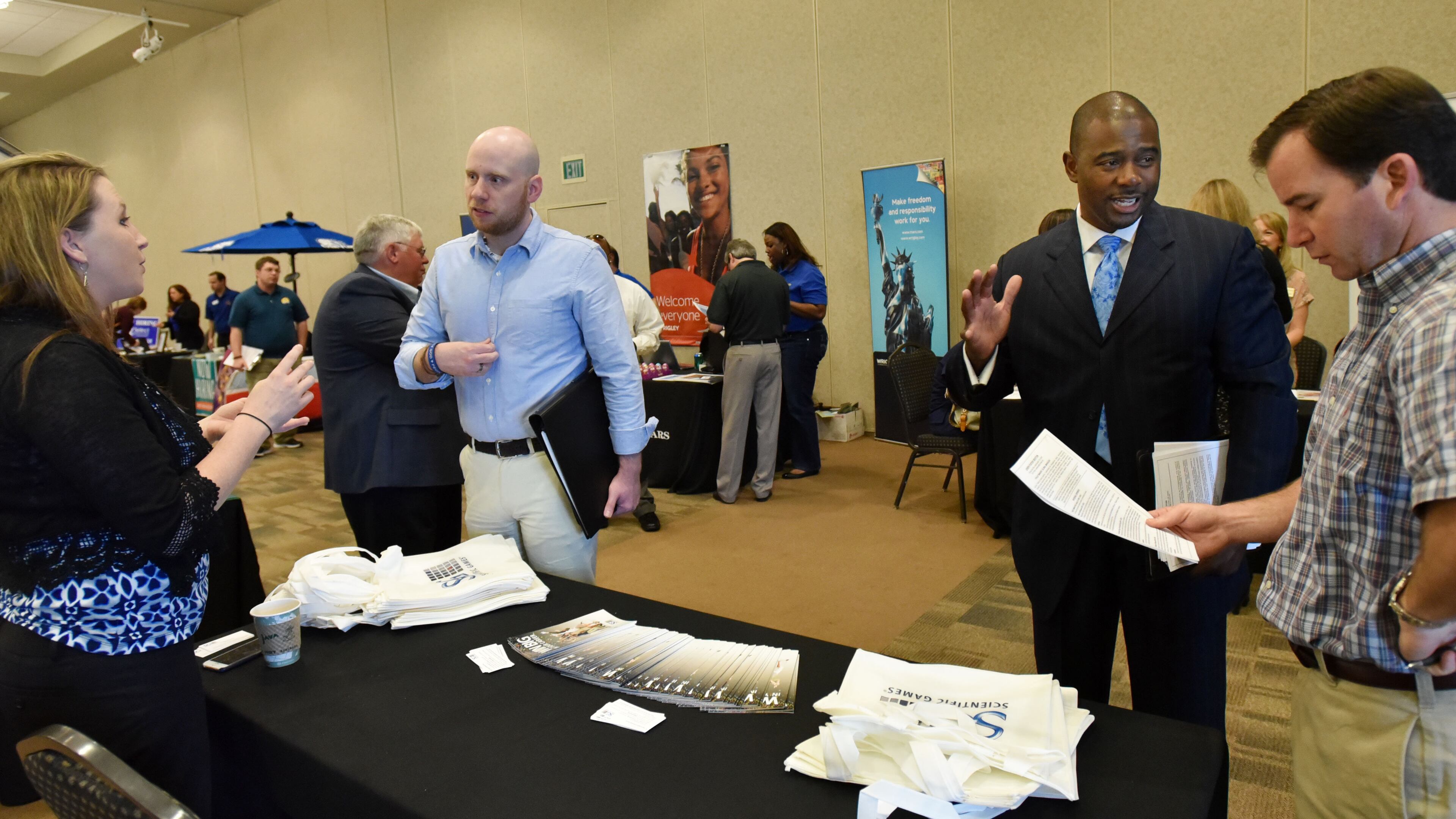 Job seekers at a fair last March in Cumming.
