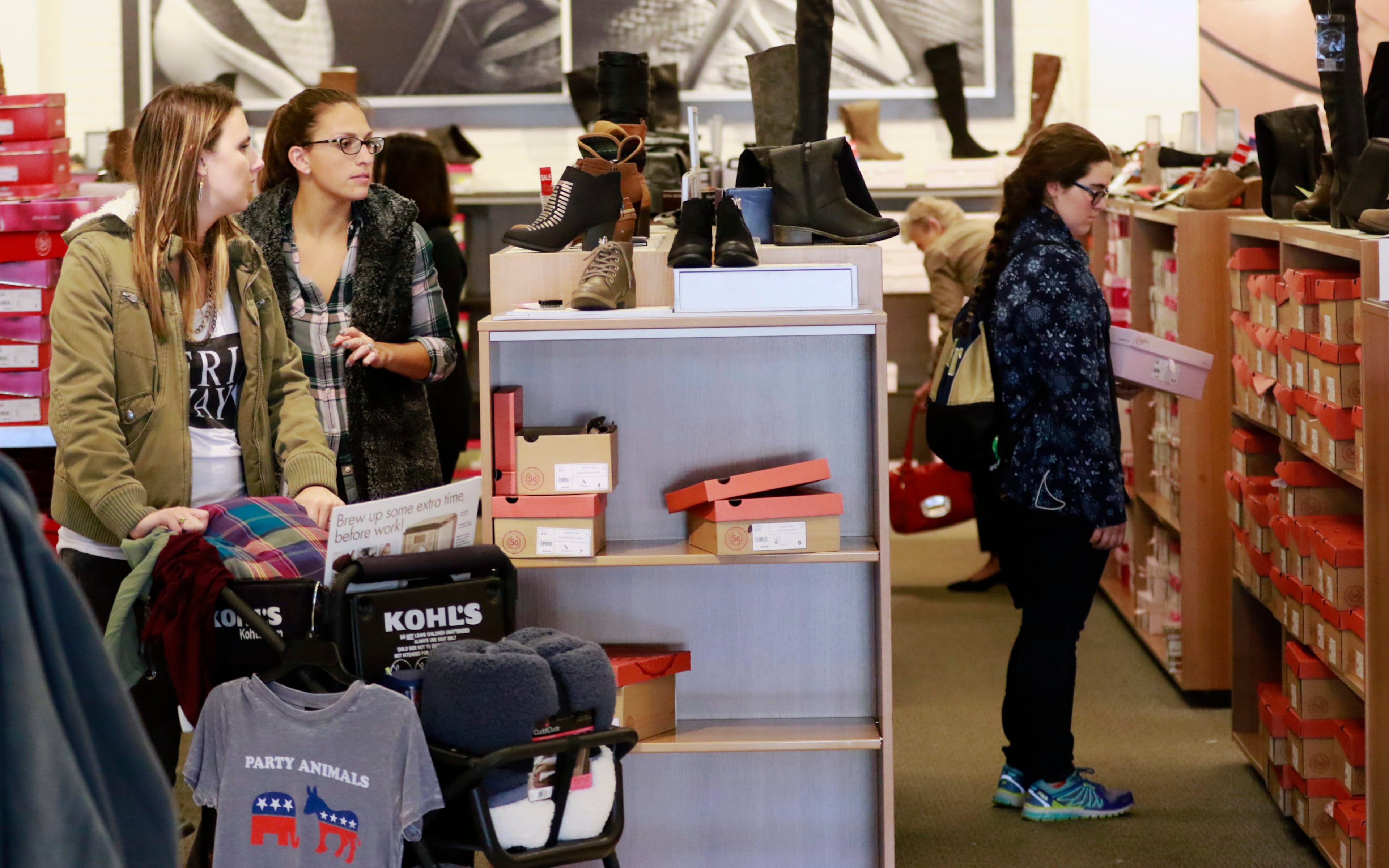 Melissa Coats (left) and Erin Simone shop in the shoe department at Kohl's.
