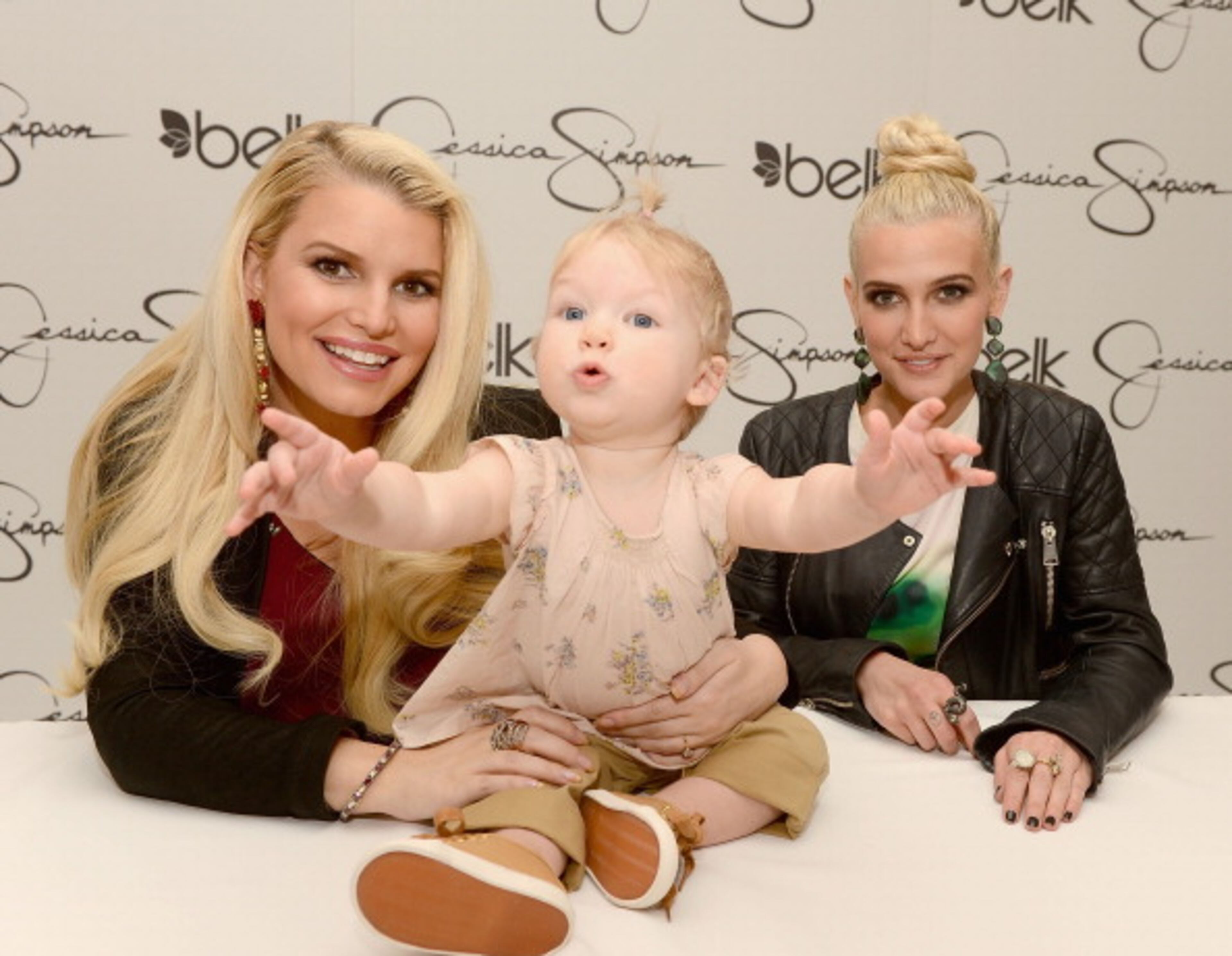 CHARLOTTE, NC - MARCH 23: (L-R) Jessica Simpson, wearing Jessica Simpson Maternity, with her daughter Maxwell Johnson and Ashlee Simpson, wearing a Jessica Simpson dress, visit Belk Southpark on March 23, 2013 in Charlotte, North Carolina. (Photo by Jamie McCarthy/Getty Images for Jessica Simpson)
