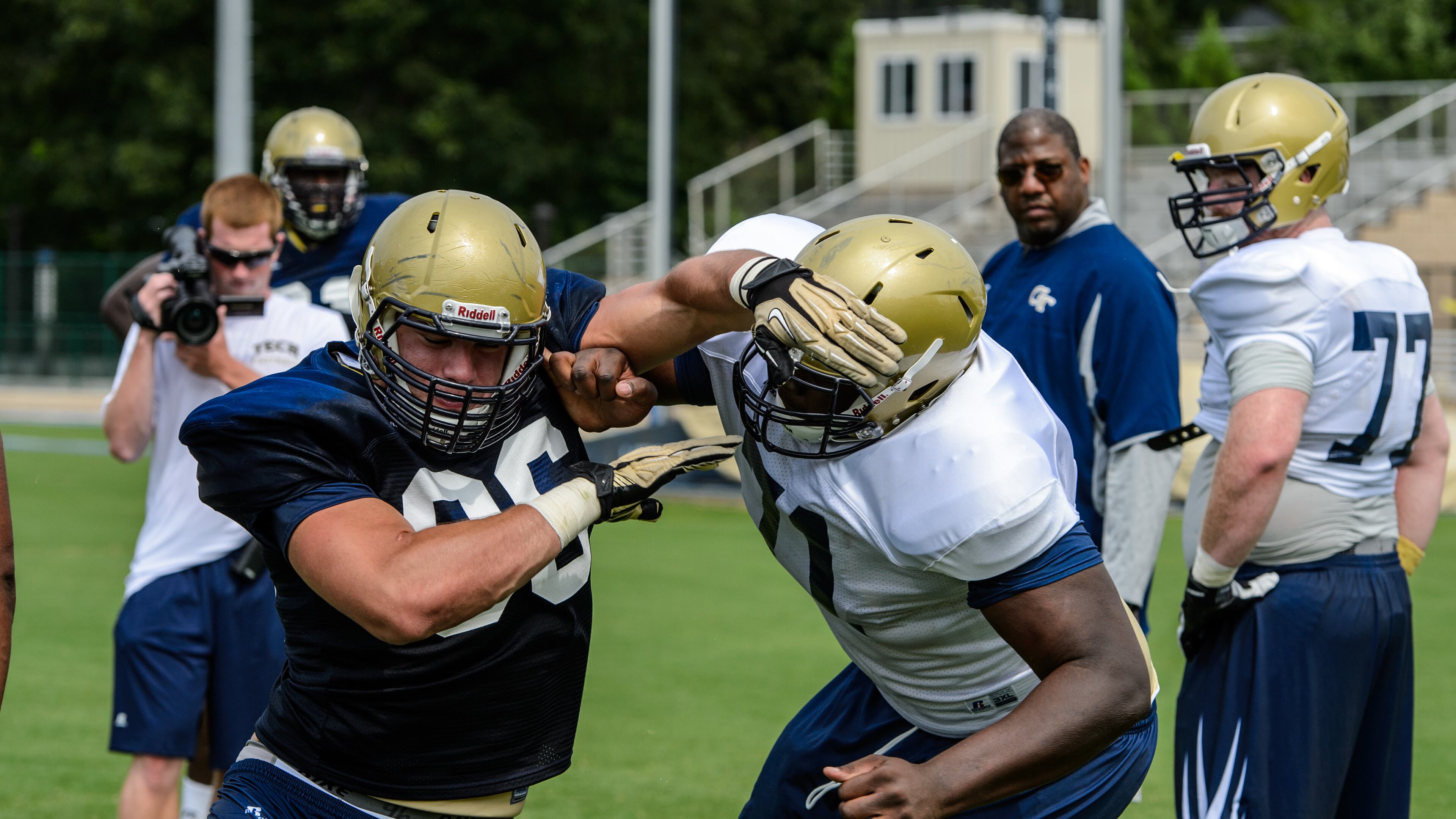 Georgia Tech defensive tackle Adam Gotsis, shown here tussling with guard Shamire Devine, said the grind of preseason camp is such that he is typically asleep by 9:15 p.m. (GEORGIA TECH/DANNY KARNIK)