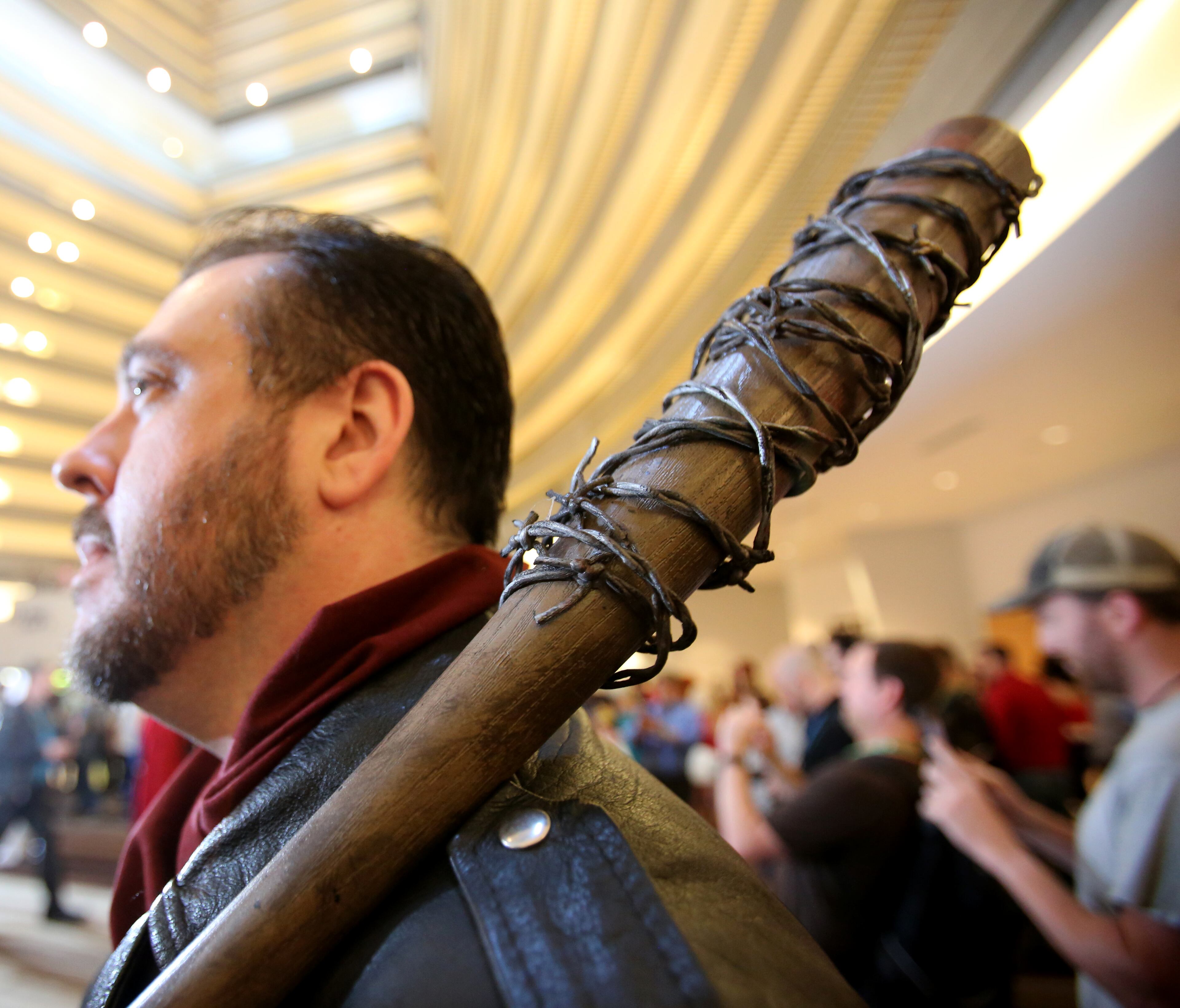 September 1, 2017 Atlanta - Drawing inspiration from the Georgia filmmed TV show âThe Walking Dead,â a replica of Negan's Bat Lucille sits up high on the shoulder of Patrick Mccoy. McCoy travelled from Virginia Beach in order to attend his fifth Dragon Con event. Dragon Con 2017 is in full fledge in its 31st year. With over 80,000 people expected to fill the streets of downtown Atlanta, the three-day event has always brought the best out of attendees and their costume-making abilities. RYON HORNE/RHORNE@AJC.COM