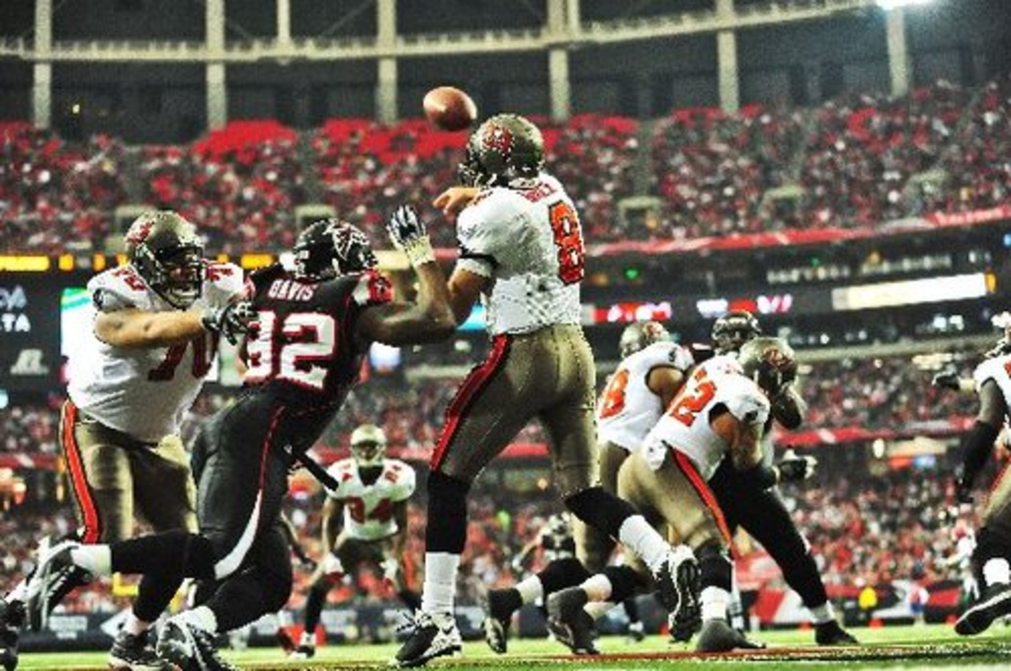 Atlanta's Chauncey Davis puts pressure on Tampa Bay QB Brian Griese in the first half. Griese played in the place of injured starting quarterback Jeff Garcia.