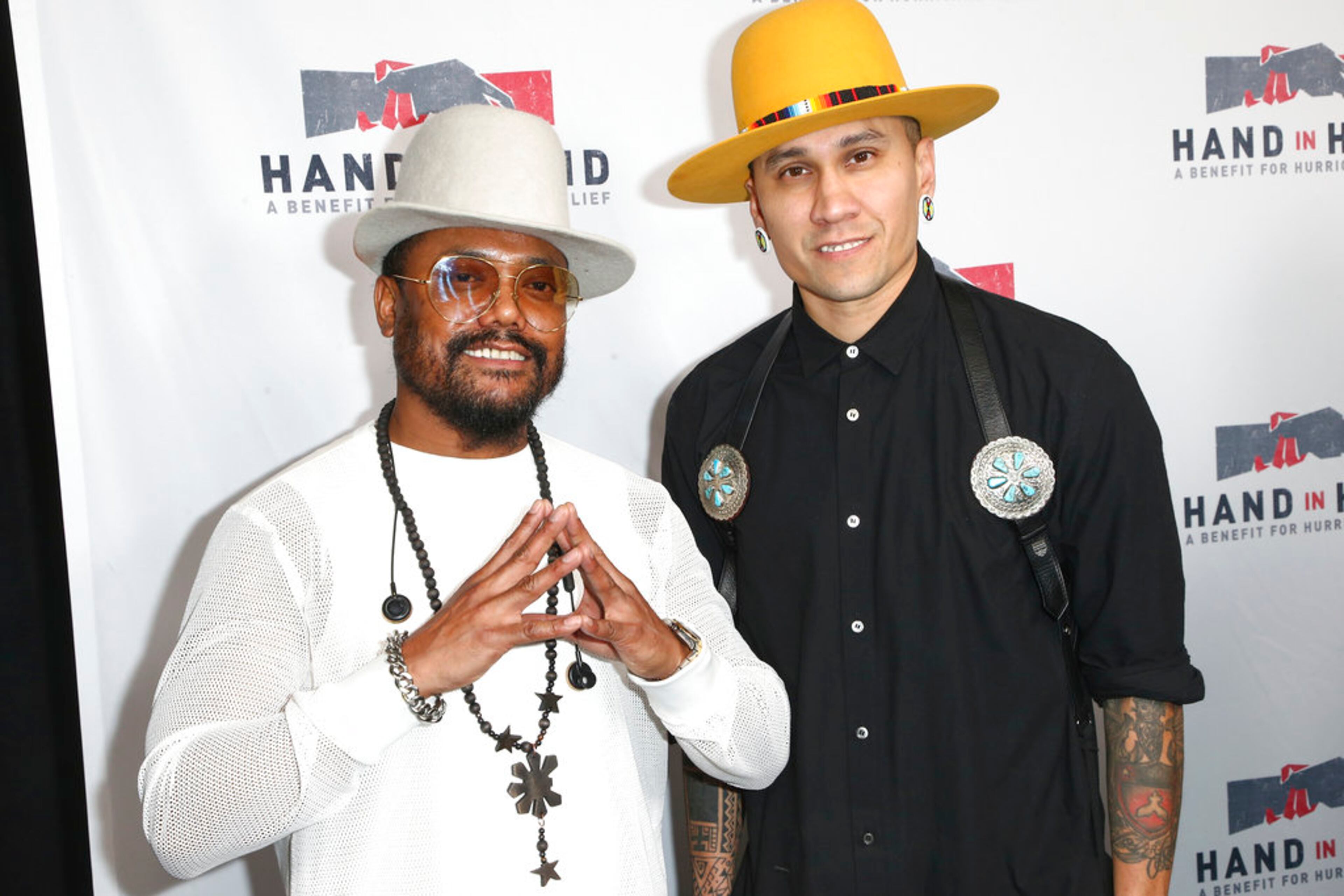 Allan Pineda Lindo, known as apl.de.ap, left, and Taboo attend the Hand in Hand: A Benefit for Hurricane Harvey Relief held at Universal Studios Back Lot on Tuesday, Sept. 12, 2017 in Universal City, Calif. (Photo by John Salangsang/Invision/AP)