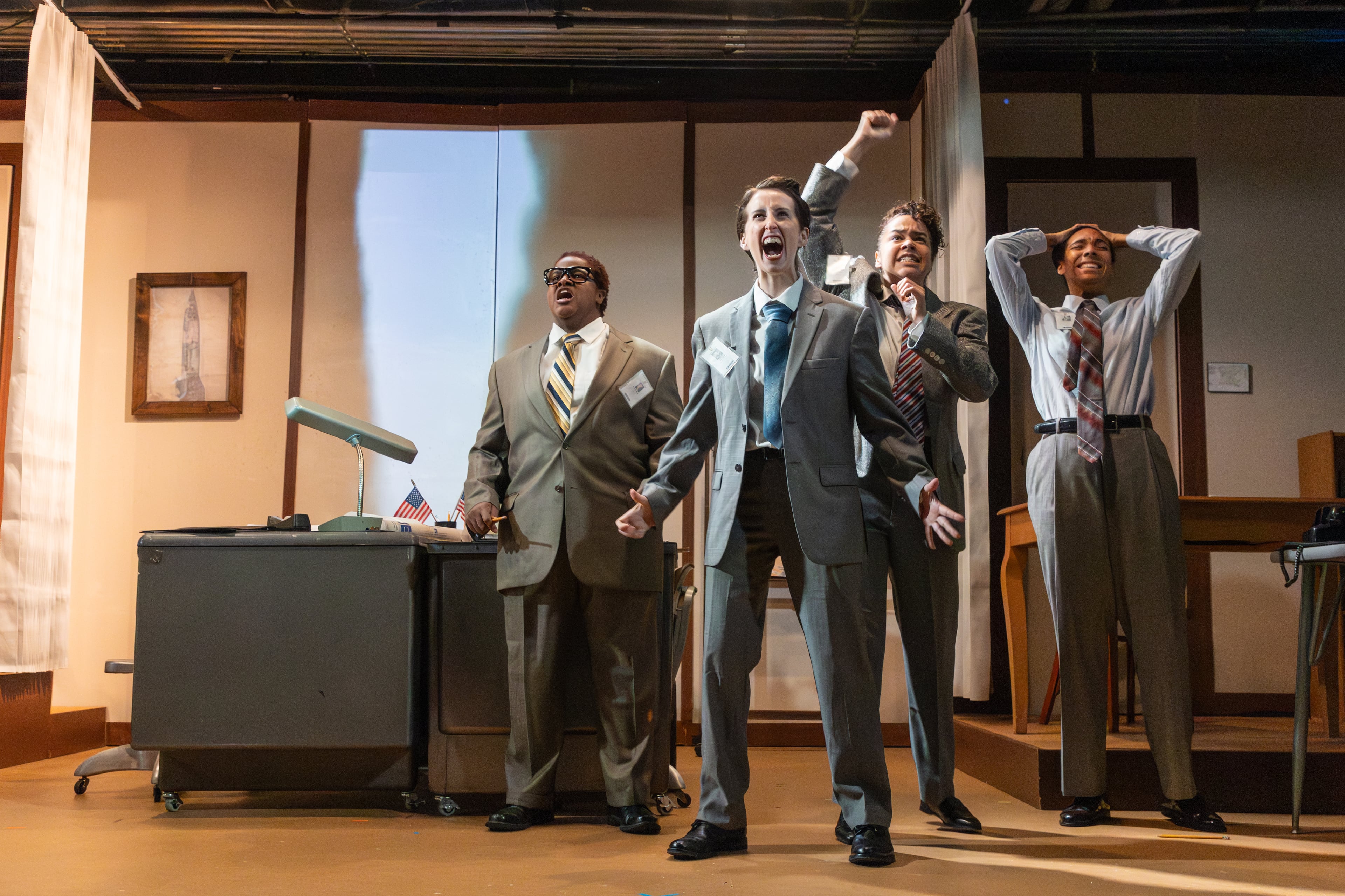 Engineers and scientists cheer as they watch their rocket take flight during a scene in Crystal Skillman's play "The Rocket Men," directed by Rachel May at Synchronicity Theatre. (Courtesy of Casey Gardner Ford)
