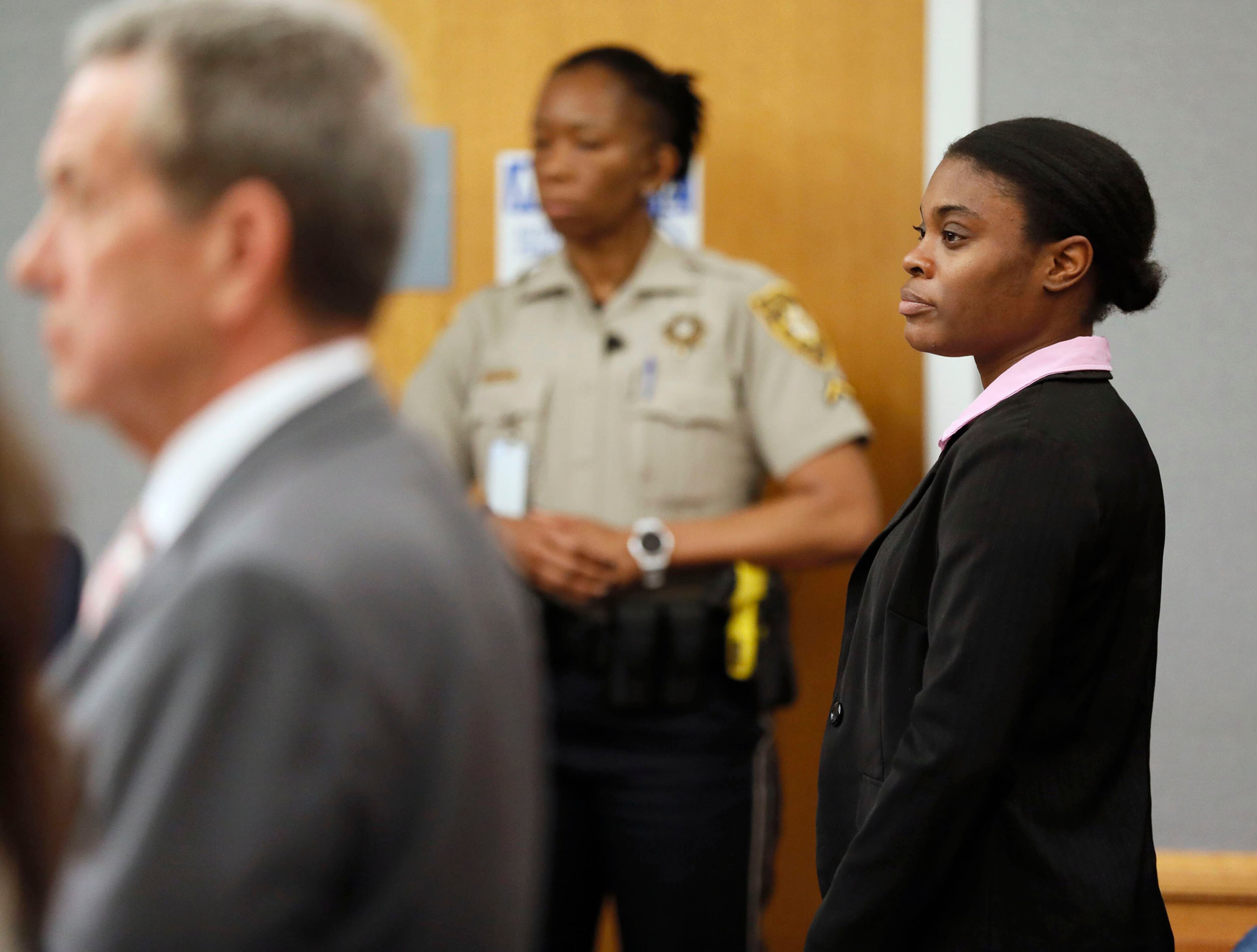 April 30, 2019 - Lawrenceville - District attorney Danny Porter (left) and Tiffany Moss stand as the jury is discharged. The jury in the Tiffany Moss murder trial today sentenced her to death after they found Moss, who is representing herself, guilty of intentionally starving her 10-year-old stepdaughter Emani to death in the fall of 2013, in addition to other charges. The prosecution is asking for the death penalty. Bob Andres / bandres@ajc.com