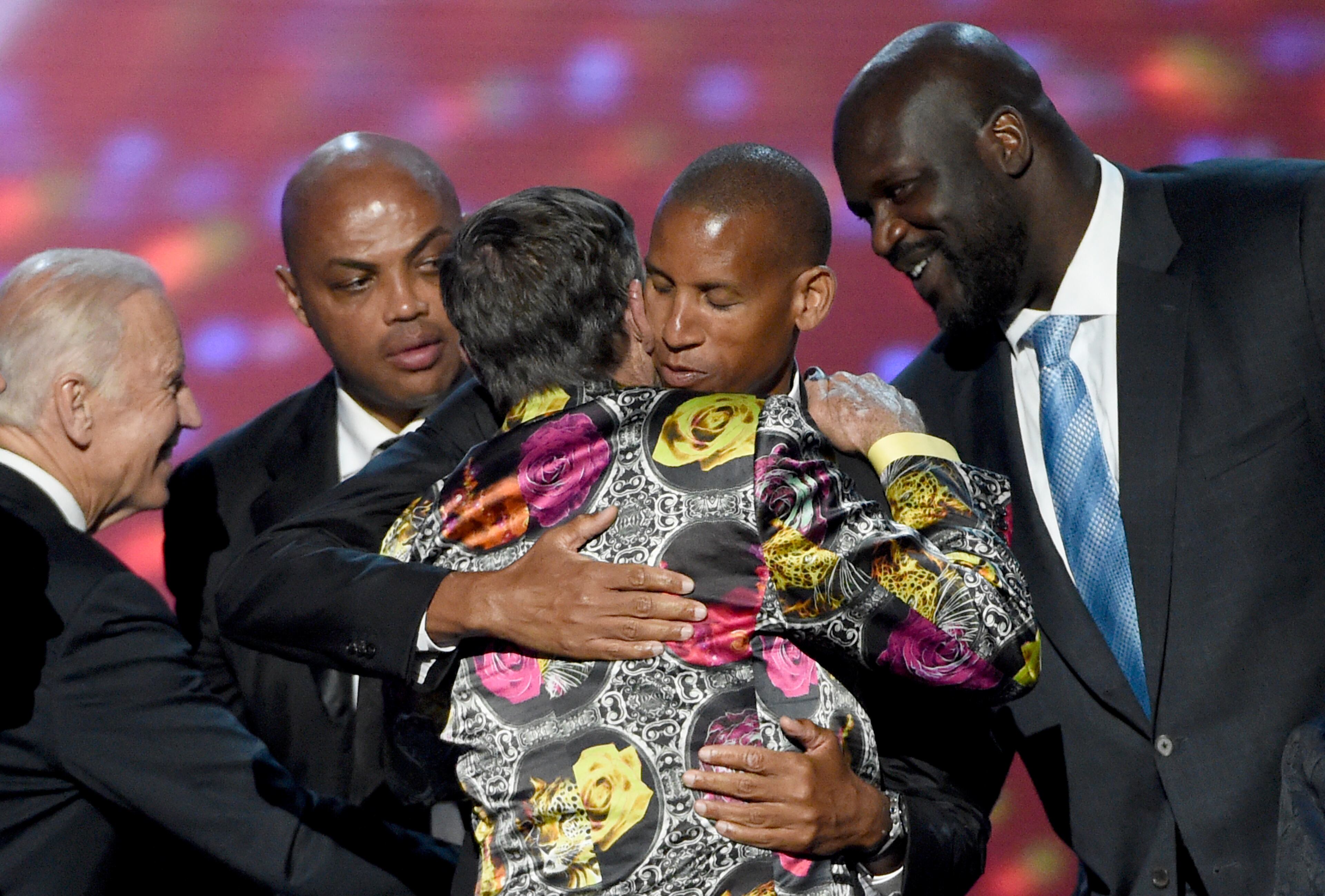 Vice President Joe Biden, left, and former NBA players Charles Barkley, Reggie Miller, and Shaquille O'Neal, right, congratulate Craig Sager as he accepted the Jimmy V award for perseverance at the ESPY Awards at the Microsoft Theater on Wednesday, July 13, 2016, in Los Angeles. (Photo by Chris Pizzello/Invision/AP)