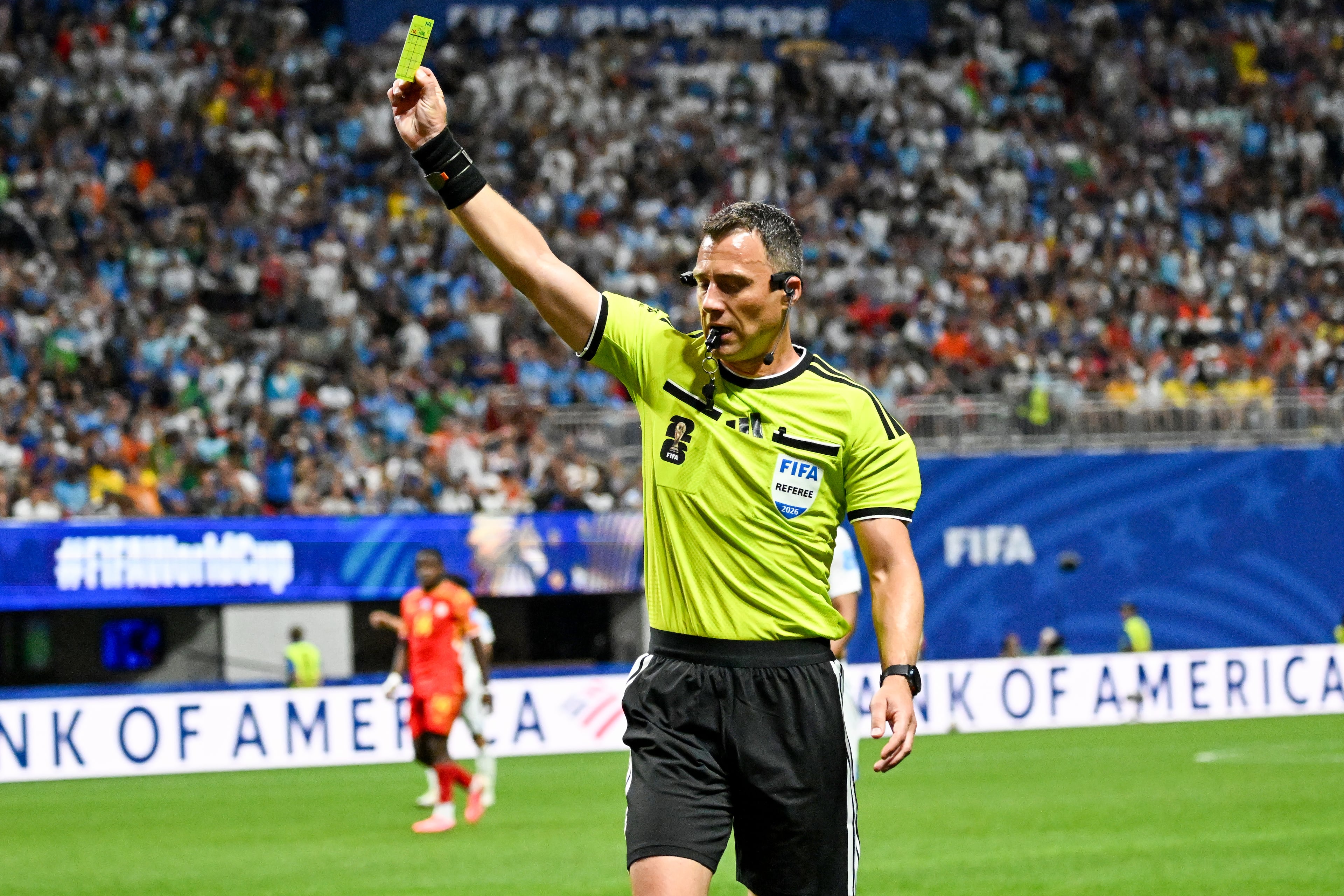 Uzbekistan defender Abdukodir Khusanov is flagged with a yellow card against Congo during the first half of a FIFA World Cup match at Atlanta Stadium (Mercedes-Benz Stadium) on Saturday, June 27, 2026, in Atlanta. (Hyosub Shin/AJC)
