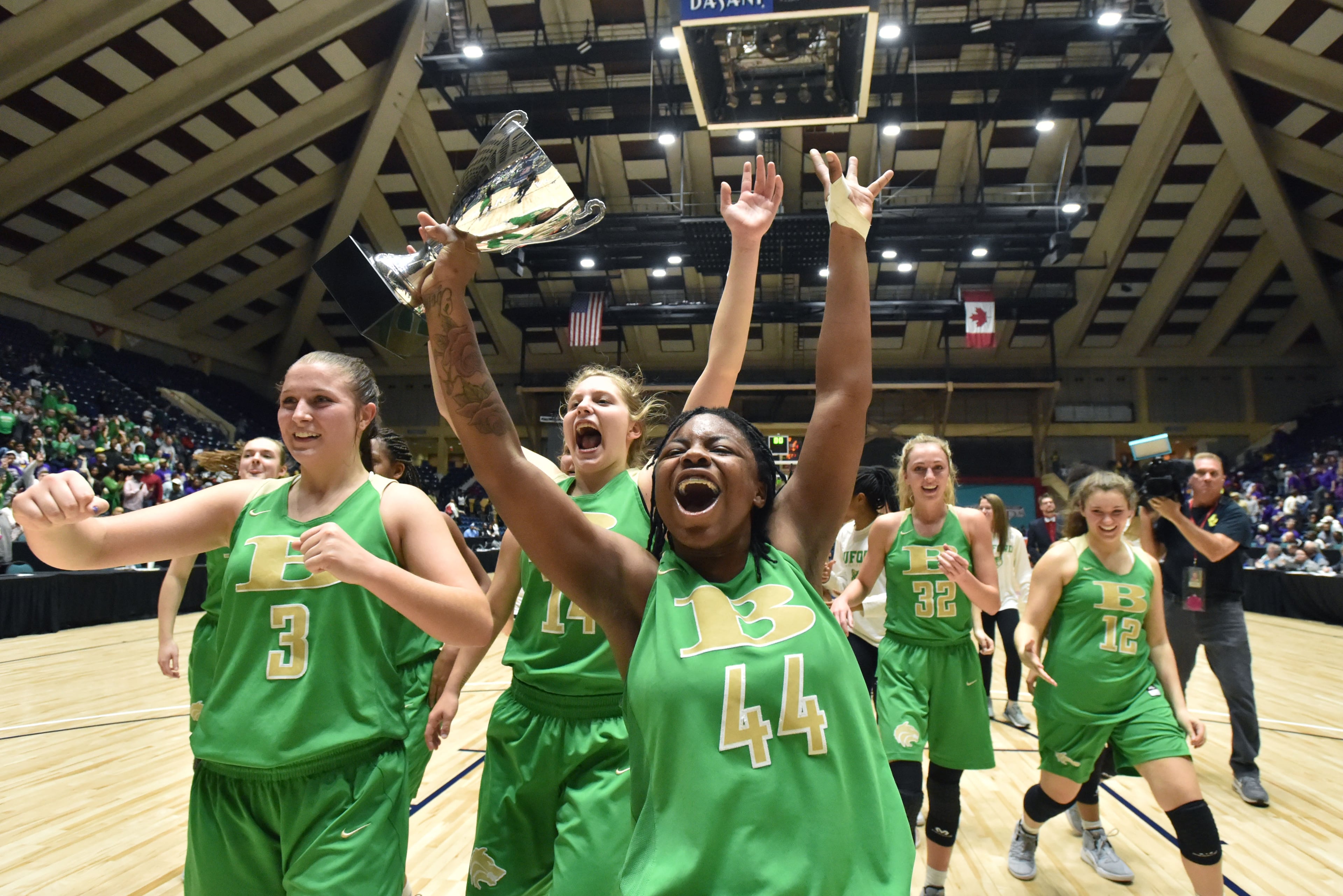 March 8, 2019 Macon - Buford Ebony Grant (44) holding the championship trophy celebrates their victory during GHSA State Basketball Championship game at the Macon Centreplex in Macon on Friday, March 8, 2019. Buford won 67-59 over the Villa Rica. HYOSUB SHIN / HSHIN@AJC.COM
