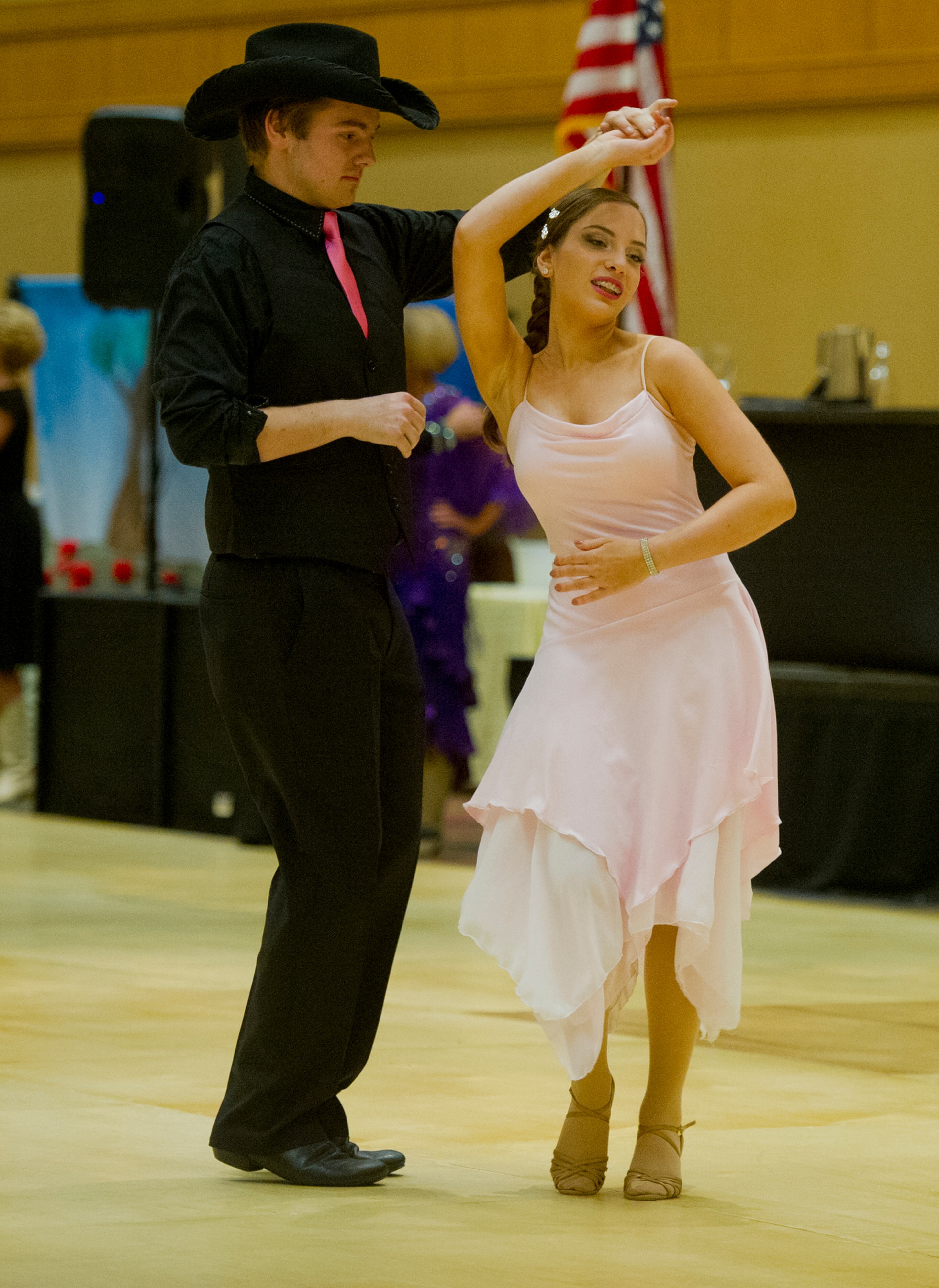 Tyler Tollett (left) dances with partner Alexis Mouser during the Peach State Dance Festival at the Crown Plaza Ravinia hotel in Atlanta on Saturday, March 22, 2014. Approximately 1,000 country, swing and line dancers filled the hotel in Dunwoody for a weekend of instruction, competition, social dancing, and dance performances. The festival is in its 24th year and is the largest of its kind in the southeast.