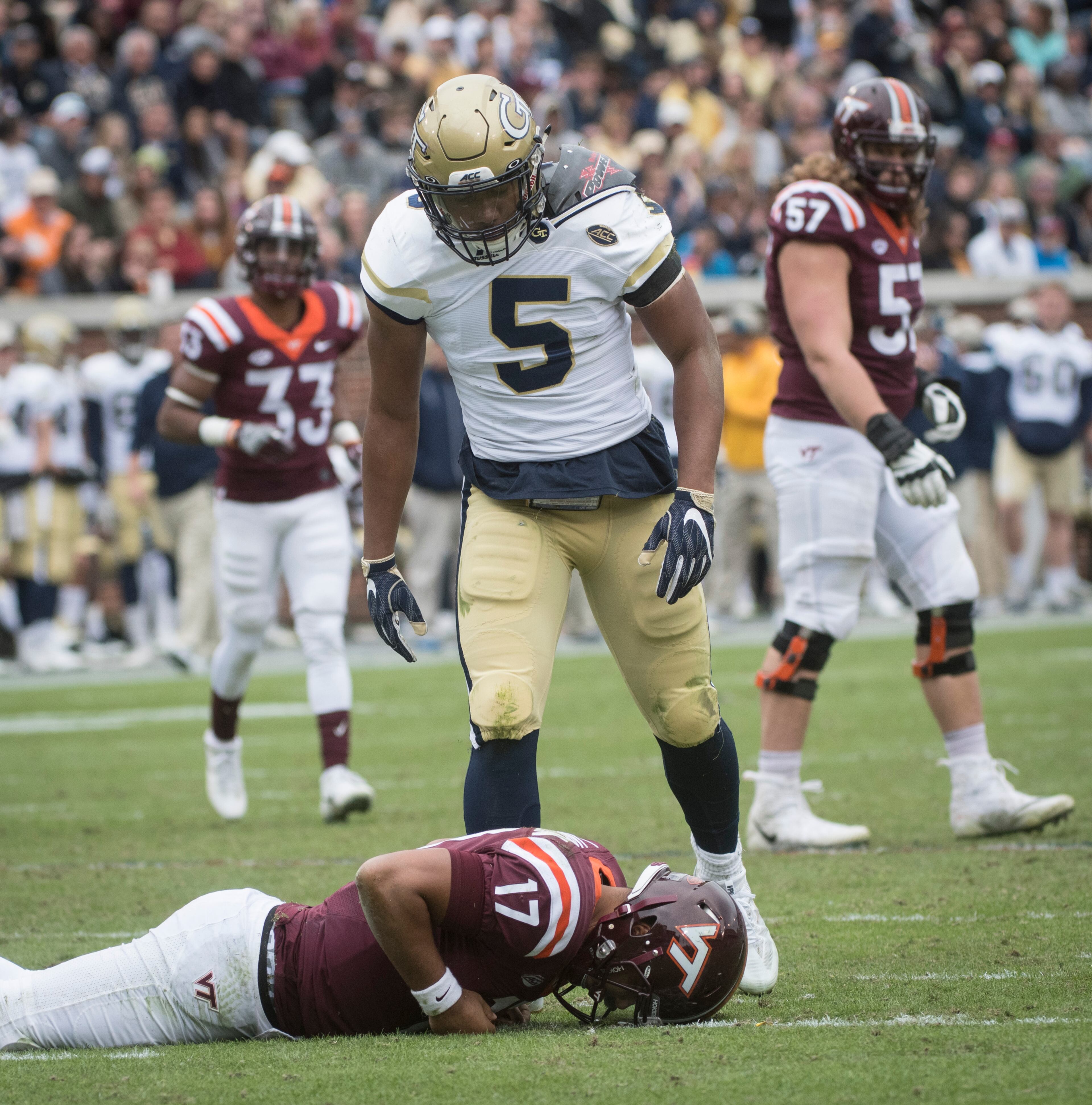 Georgia Tech defensive back A.J. Gray (5) looks over Virginia Tech quarterback Josh Jackson (17) after taking him down during the second half of a football game on Saturday, Nov.11, 2017, in Atlanta. (Photo/John Amis)