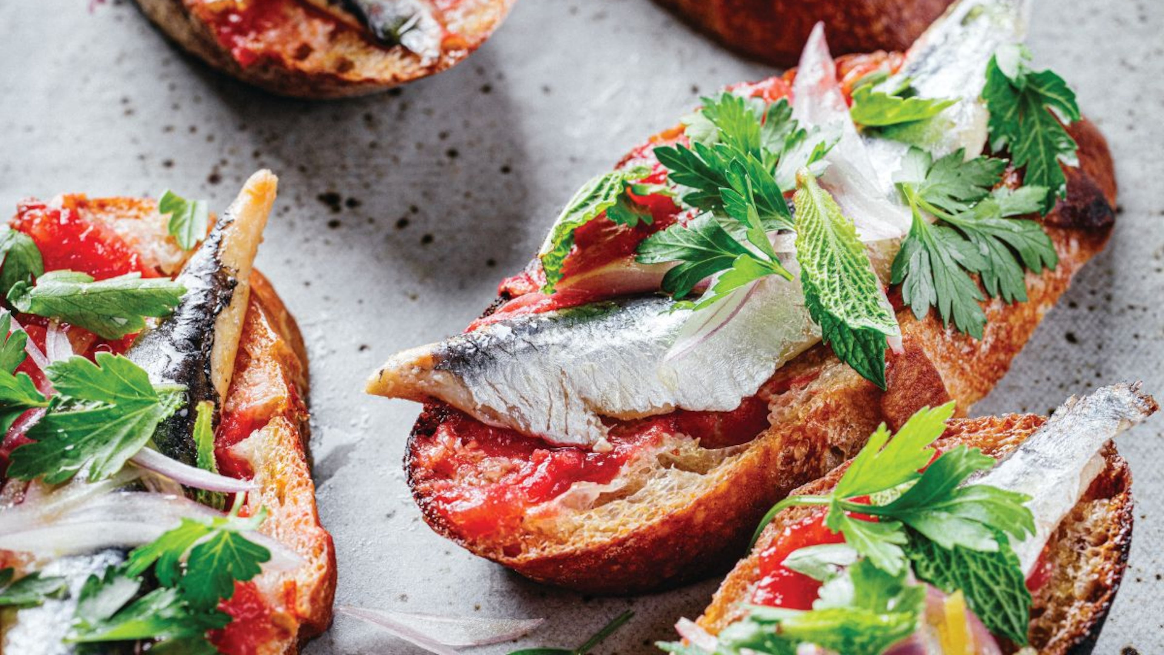 Andrew Zimmern's pan con tomate is a simple recipe that's perfect for early season tomatoes. (Eric Wolfinger)