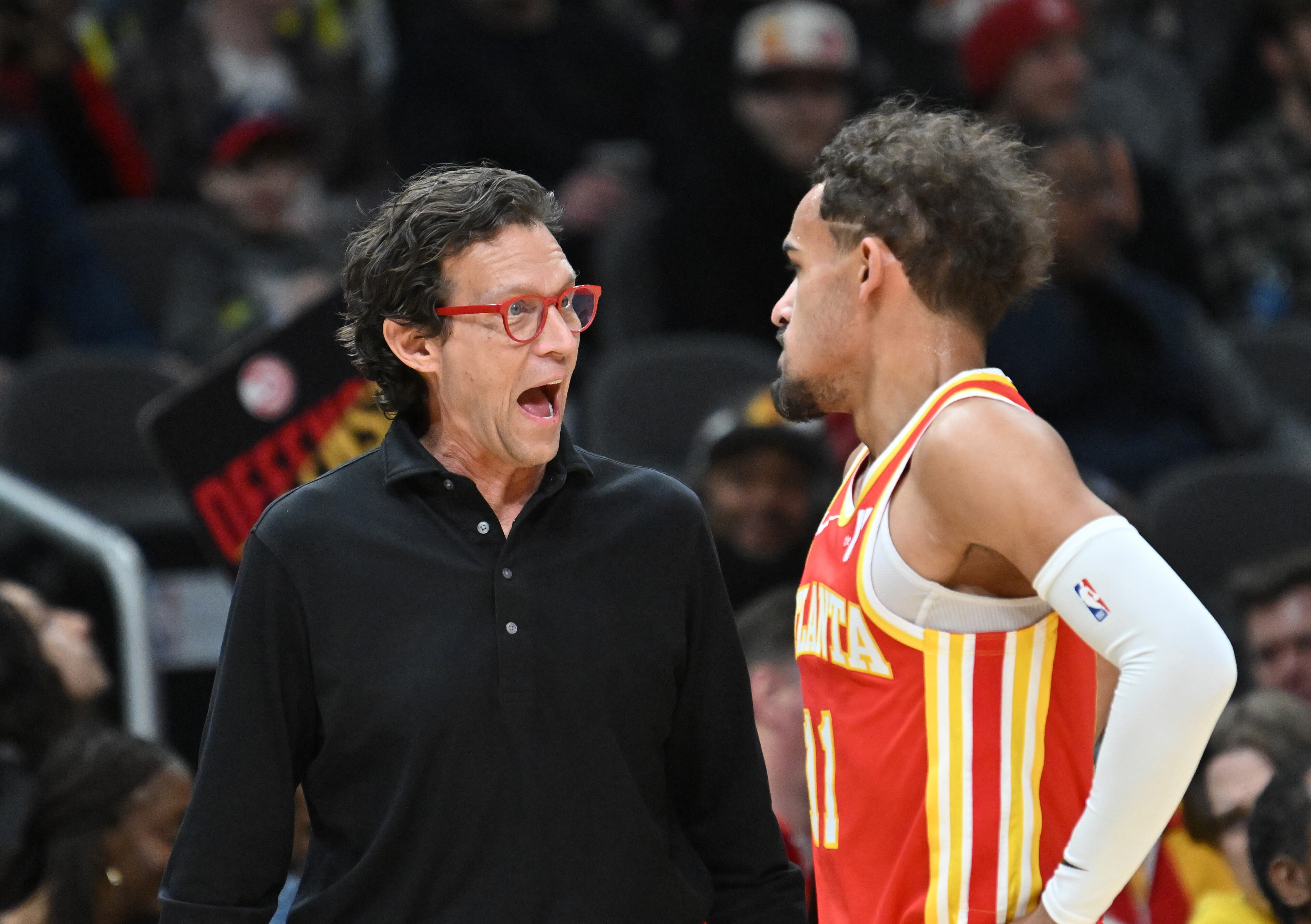 Atlanta Hawks head coach Quin Snyder talks to guard Trae Young (11) during the first half in an NBA basketball game at State Farm Arena, Friday, February 2, 2024, in Atlanta. (Hyosub Shin / Hyosub.Shin@ajc.com)