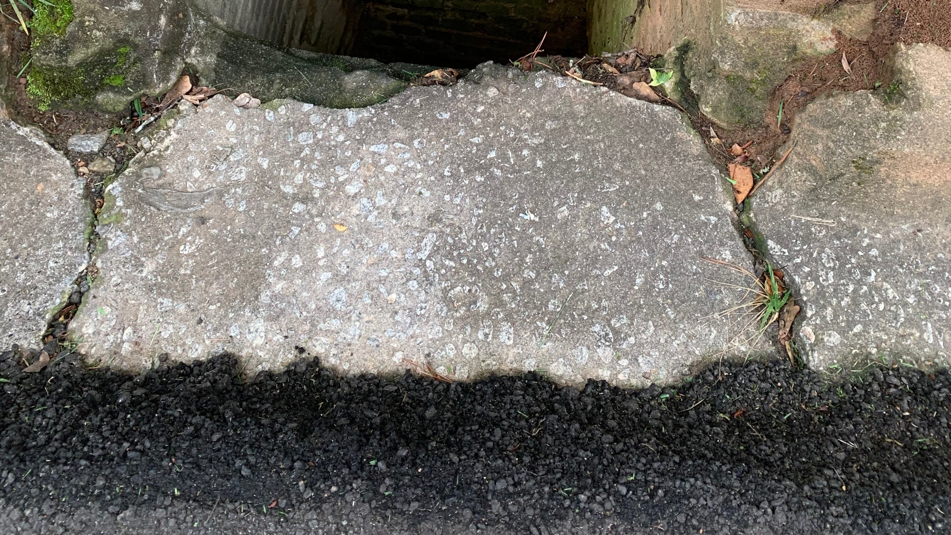 Linda Grivas hopes this broken sewer cover can be repaired before another accident occurs. Photo/Linda Grivas.