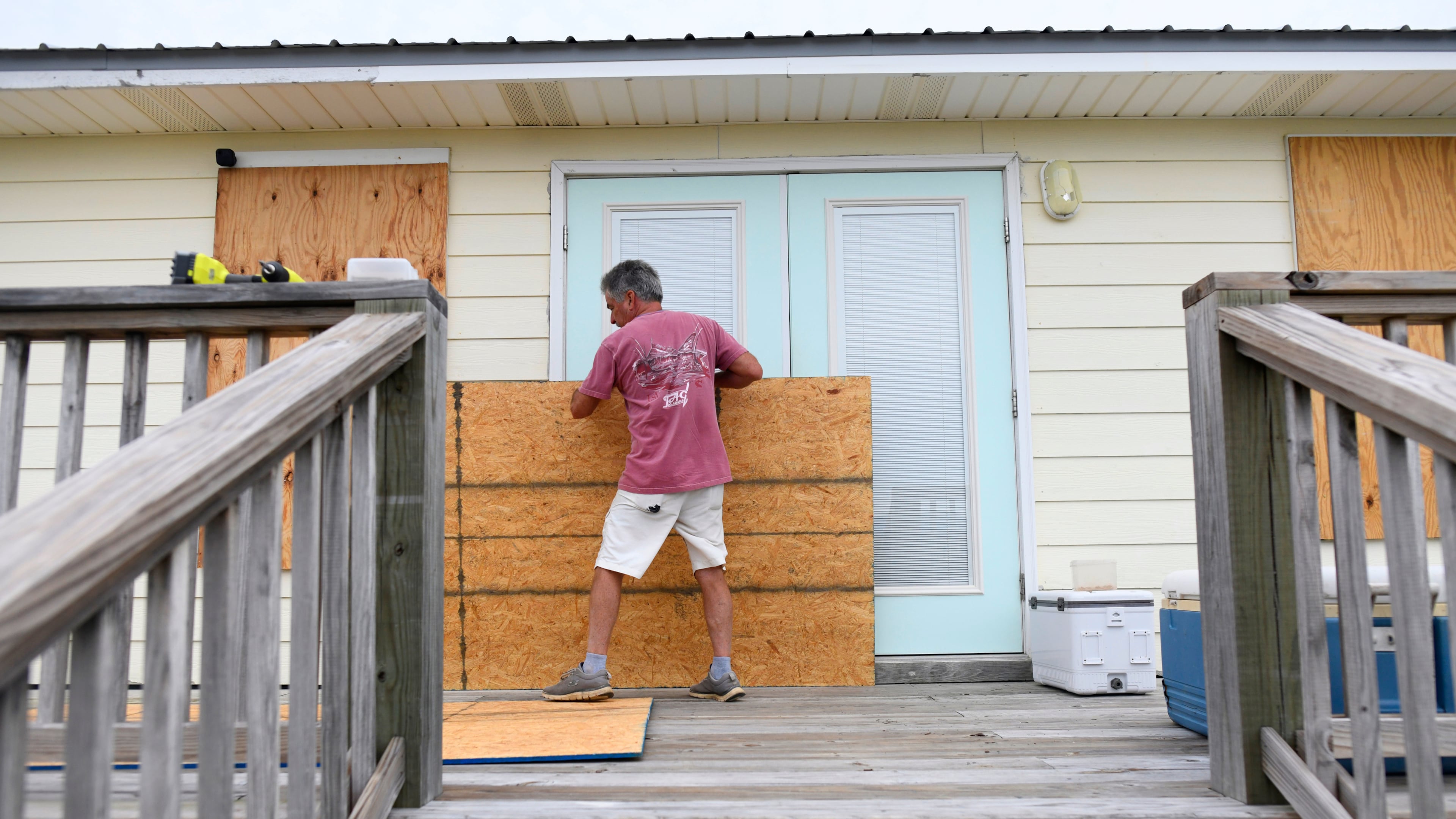 Larry Smith boards up his home with plywood ahead of Hurricane Isaias' expected landfall along the Gulf Coast in Dauphin Island, Alabama, Thursday, Oct. 8, 2026. (AP Photo/Octavio Jones)