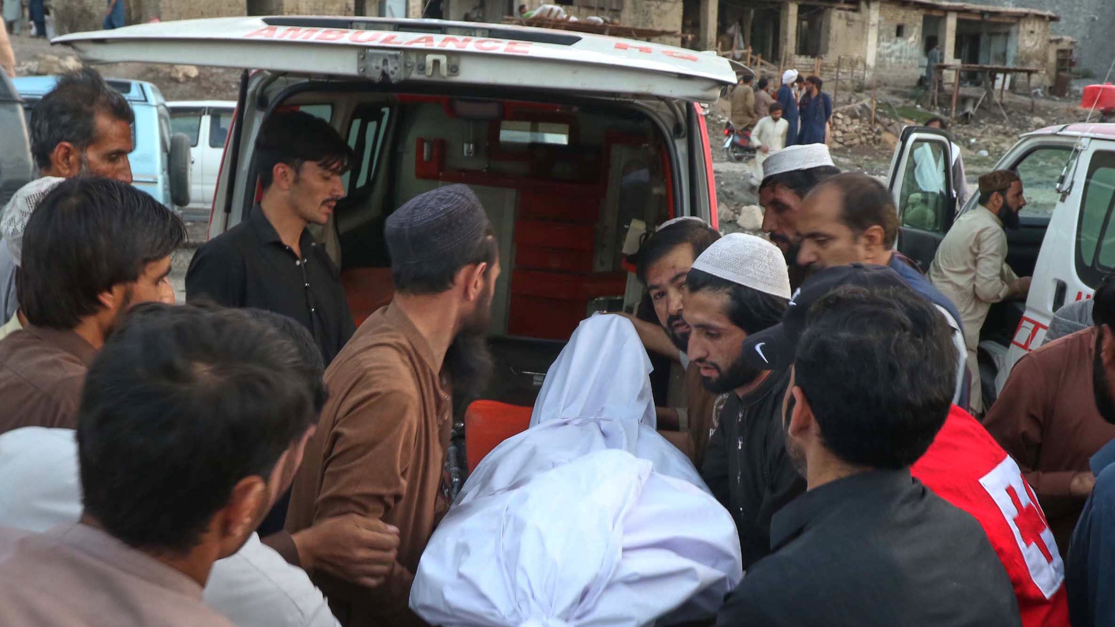 People place the body of a miner recovered after an explosion inside a coal mine, into an ambulance on the outskirts of Quetta, in southwest Pakistan, Thursday, July 30, 2026. (AP Photo/Fazal Tawab)