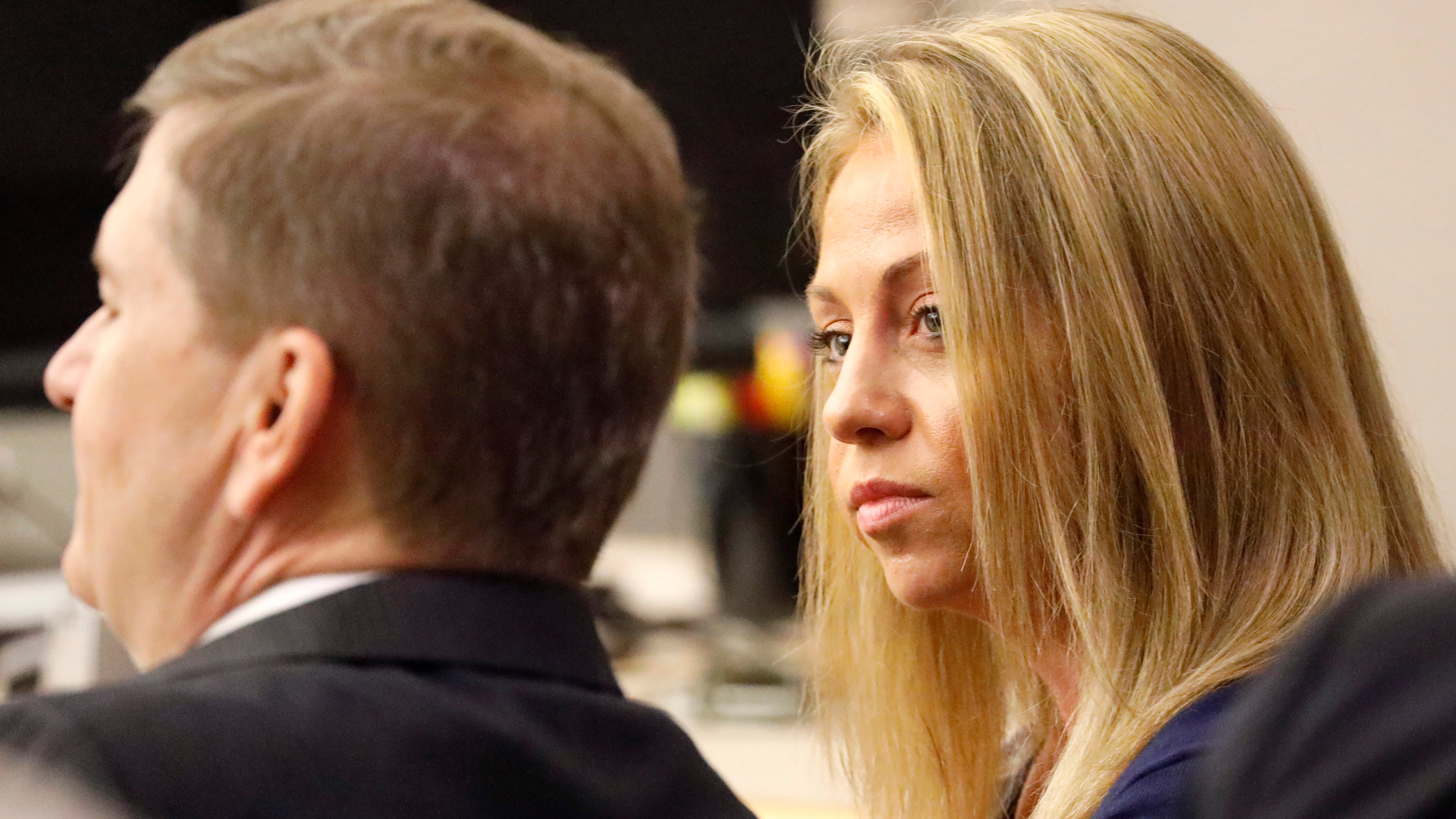 FILE - Fired Dallas police officer Amber Guyger looks toward her attorney before proceedings in her murder trial in Dallas on Sept. 25, 2019. (Tom Fox/The Dallas Morning News via AP, Pool, File)