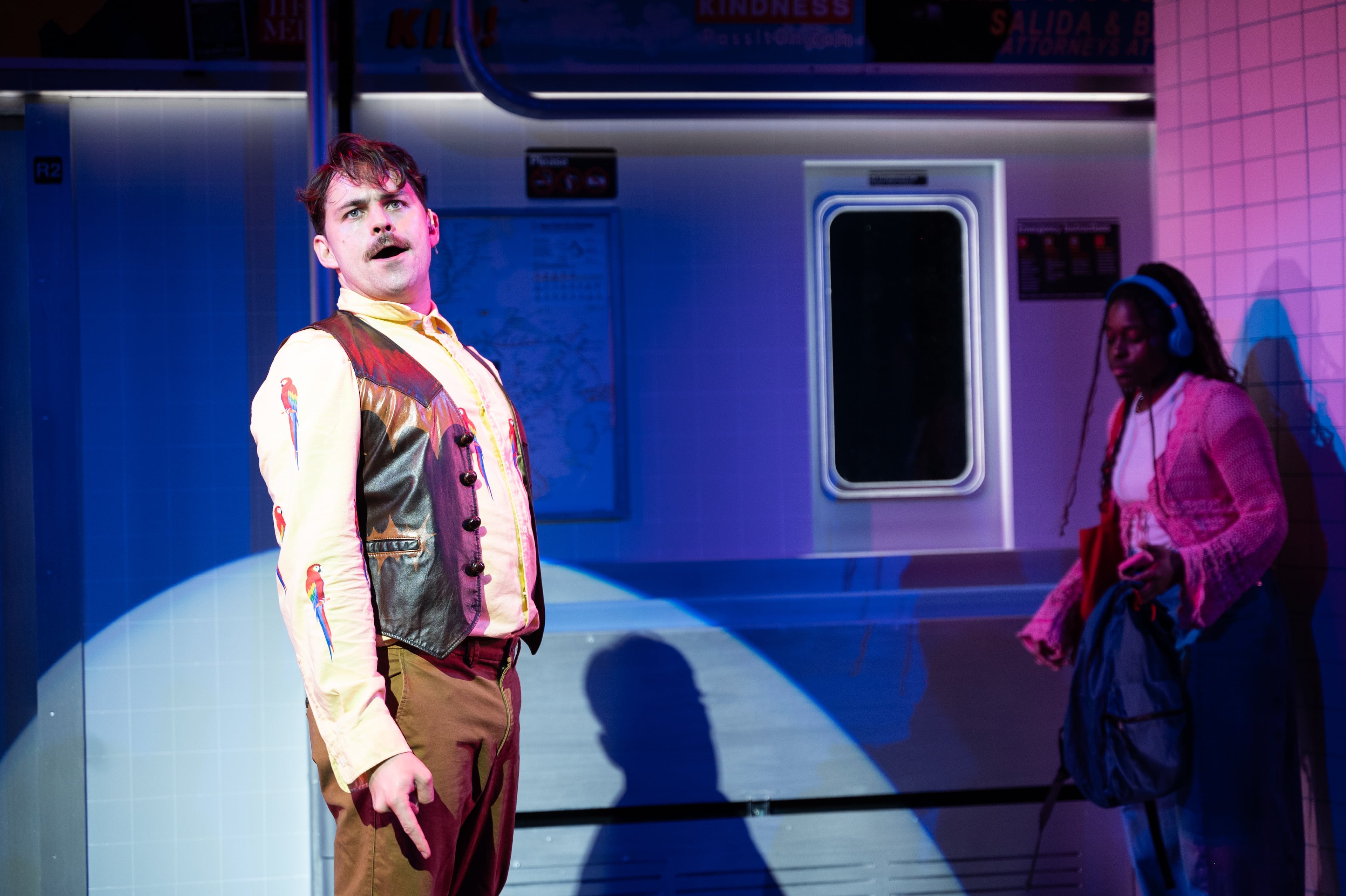 Jordan Patrick sings in the subway in "Milo Imagines the World" at Alliance Theatre. (Courtesy of Greg Mooney/Alliance Theatre)